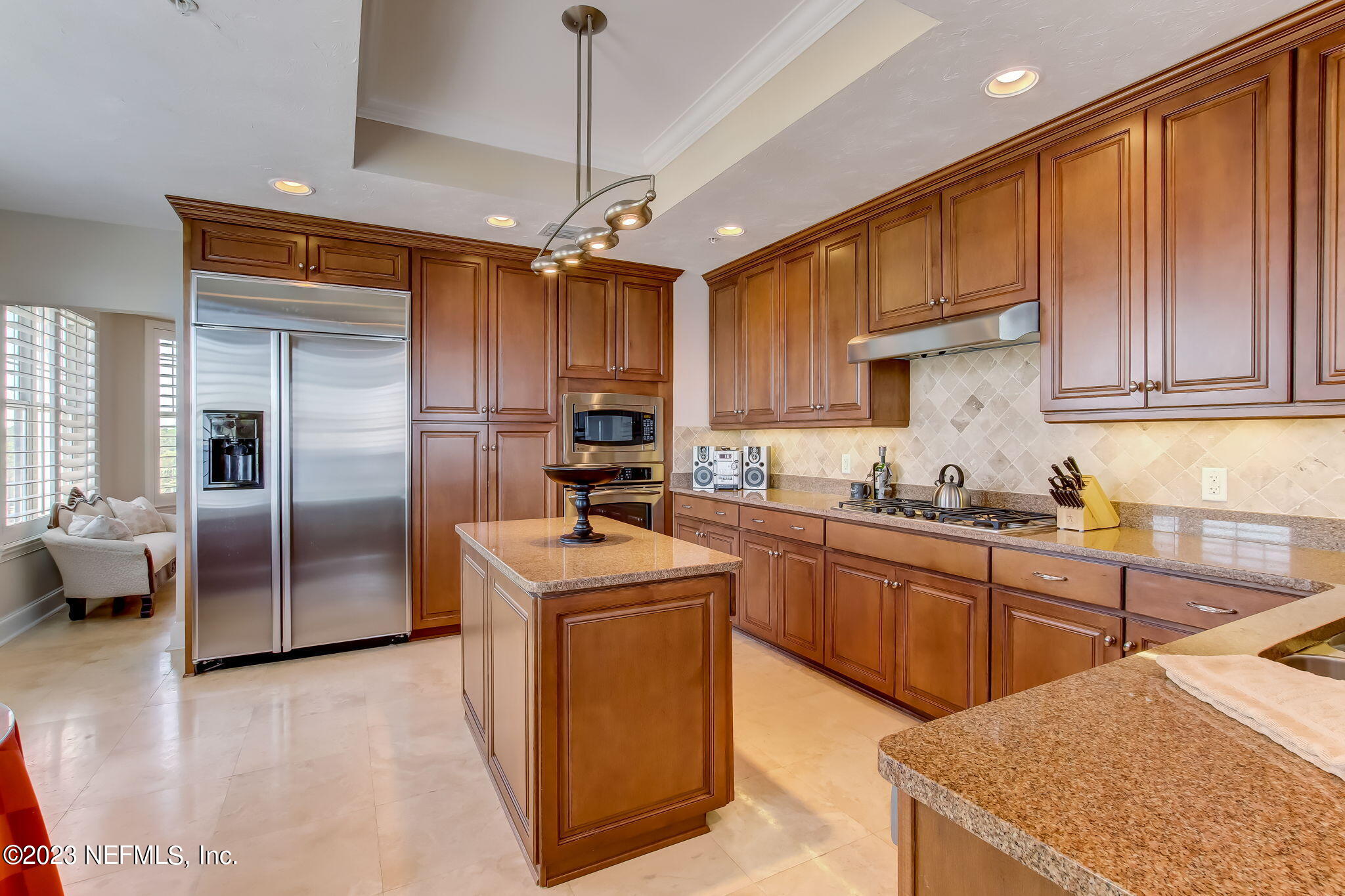 2358 Riverside Avenue, Unit 406 Jacksonville, FL 32204 - Photo 14 of 54 a kitchen with stainless steel appliances granite countertop a sink a stove and a refrigerator