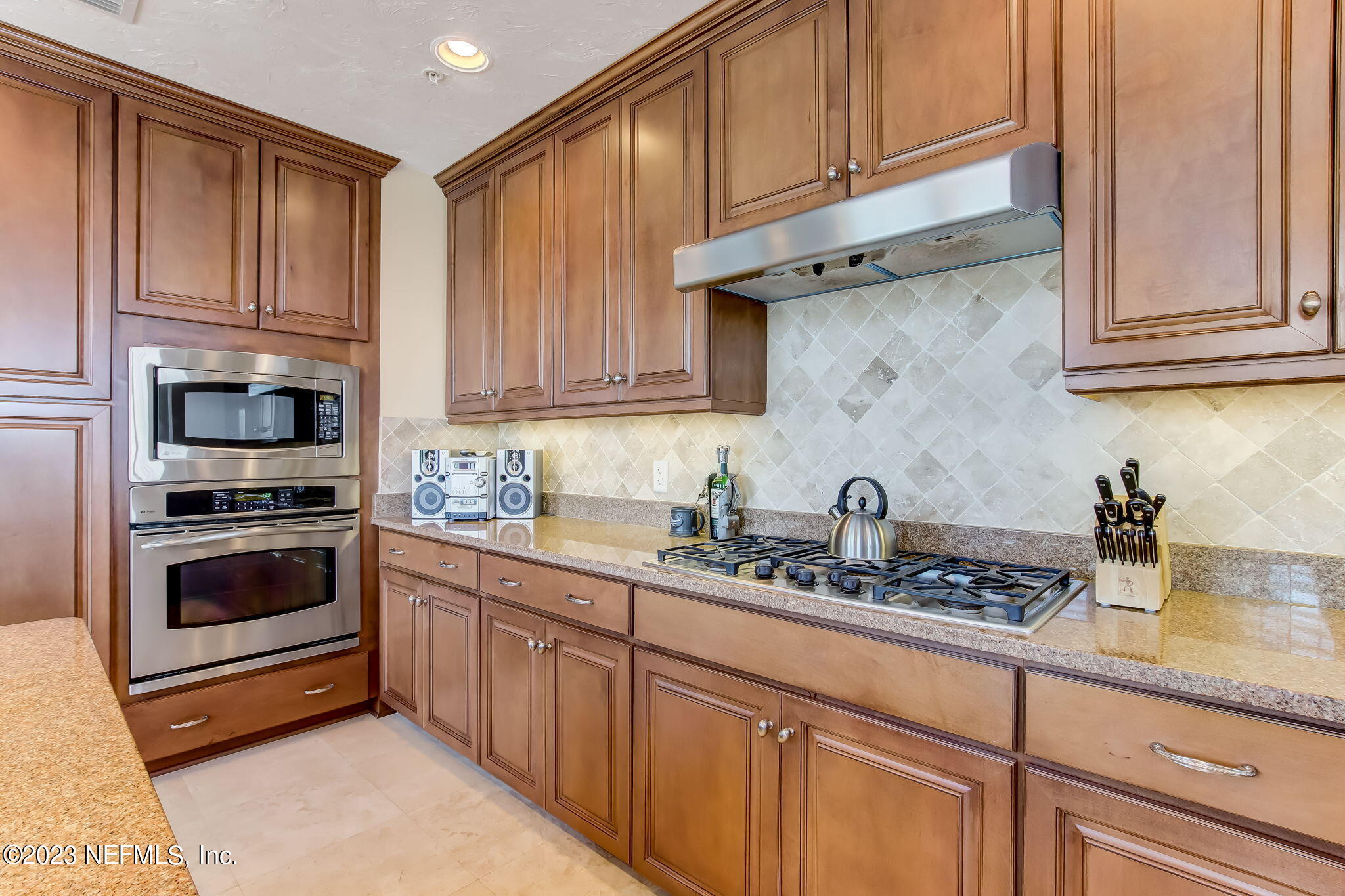 2358 Riverside Avenue, Unit 406 Jacksonville, FL 32204 - Photo 16 of 54 a kitchen with stainless steel appliances granite countertop a sink stove and cabinets