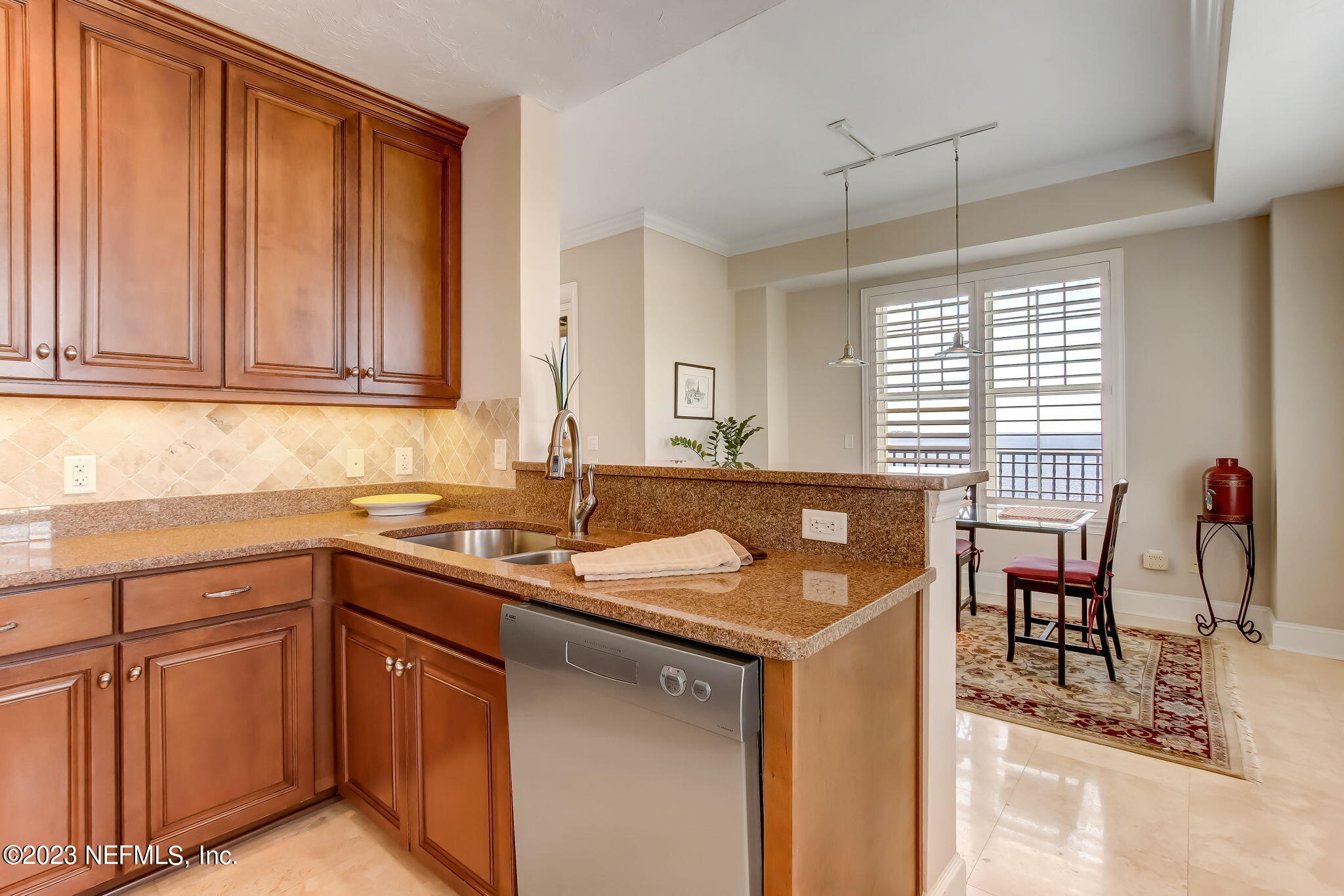 2358 Riverside Avenue, Unit 406 Jacksonville, FL 32204 - Photo 18 of 54 a kitchen with a sink stove and cabinets