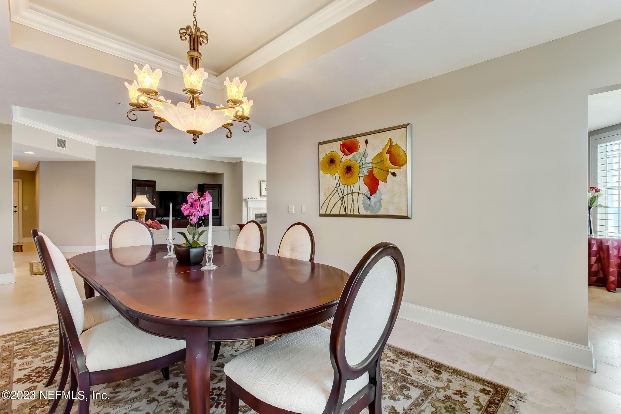 2358 Riverside Avenue, Unit 406 Jacksonville, FL 32204 - Photo 20 of 54 a view of a dining room with furniture and chandelier