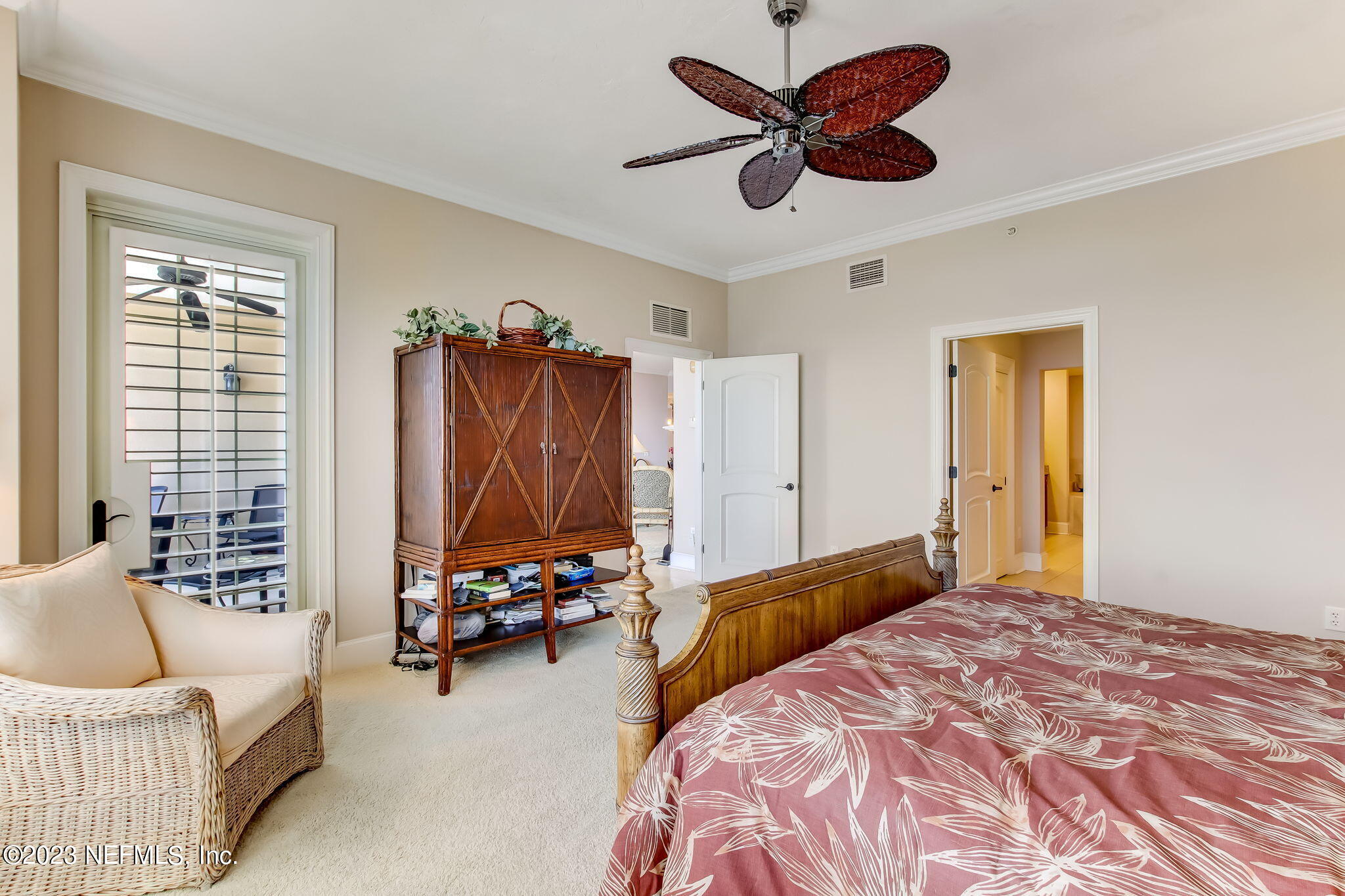 2358 Riverside Avenue, Unit 406 Jacksonville, FL 32204 - Photo 23 of 54 a bedroom with a bed furniture and a large window