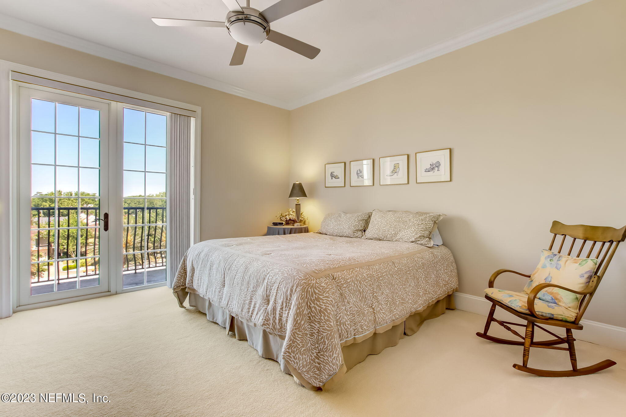 2358 Riverside Avenue, Unit 406 Jacksonville, FL 32204 - Photo 26 of 54 a spacious bedroom with a bed a chair and a large window