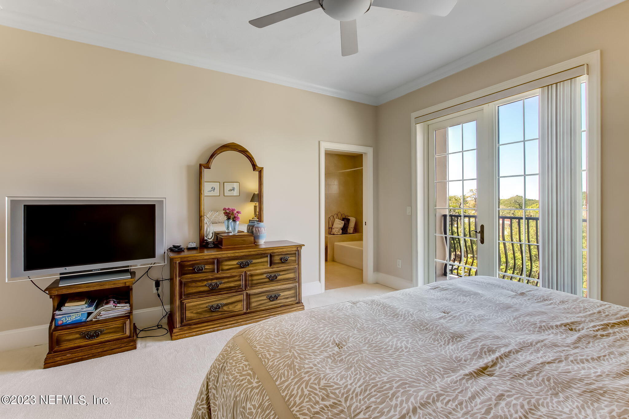 2358 Riverside Avenue, Unit 406 Jacksonville, FL 32204 - Photo 27 of 54 a bedroom with a bed and a flat screen tv