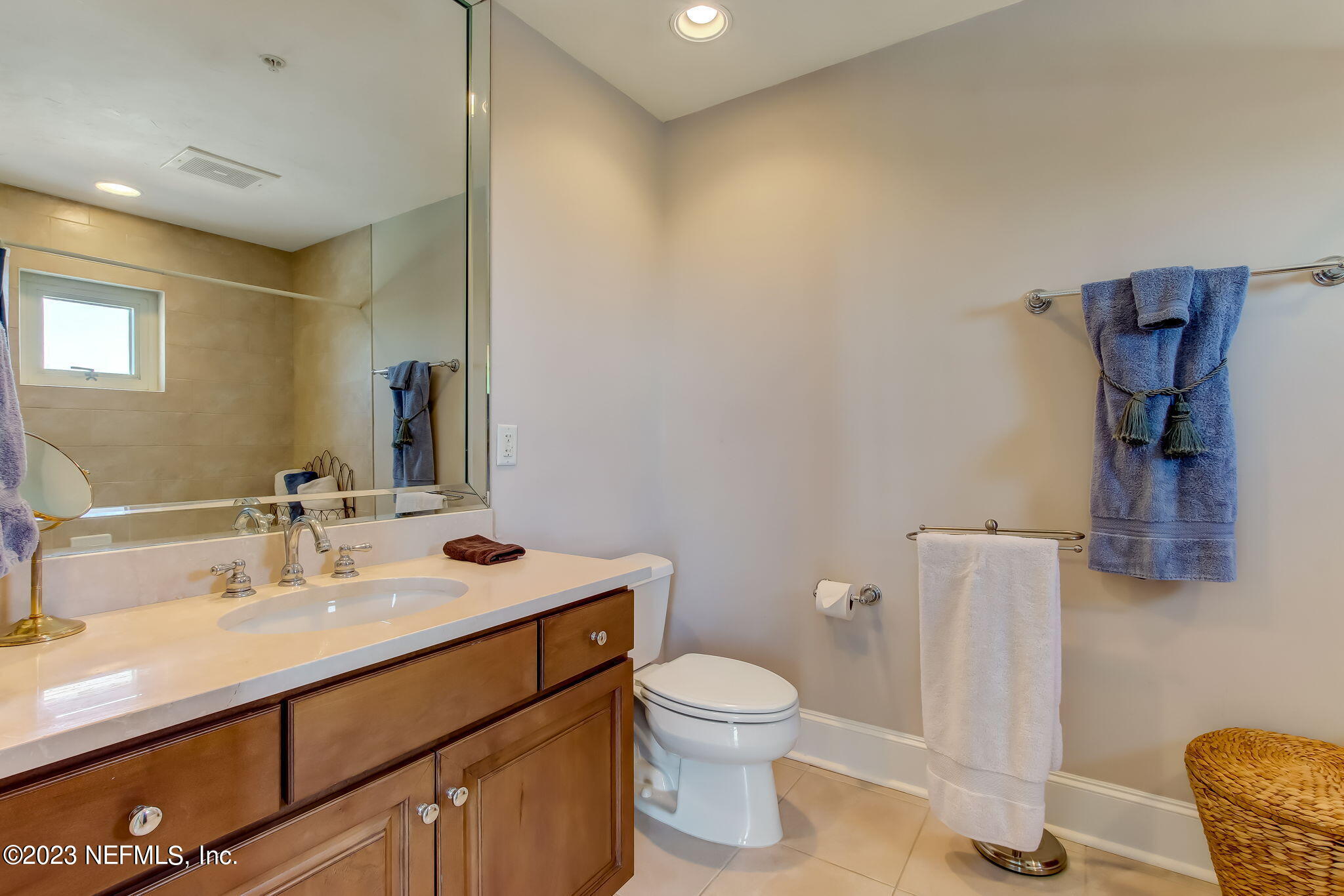 2358 Riverside Avenue, Unit 406 Jacksonville, FL 32204 - Photo 28 of 54 a bathroom with a sink mirror vanity and toilet