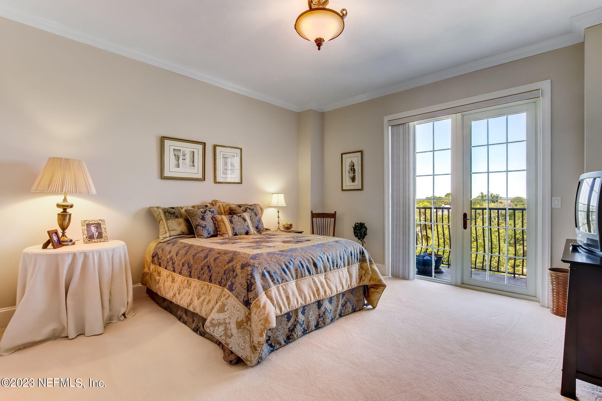 2358 Riverside Avenue, Unit 406 Jacksonville, FL 32204 - Photo 29 of 54 a spacious bedroom with a bed and a couch