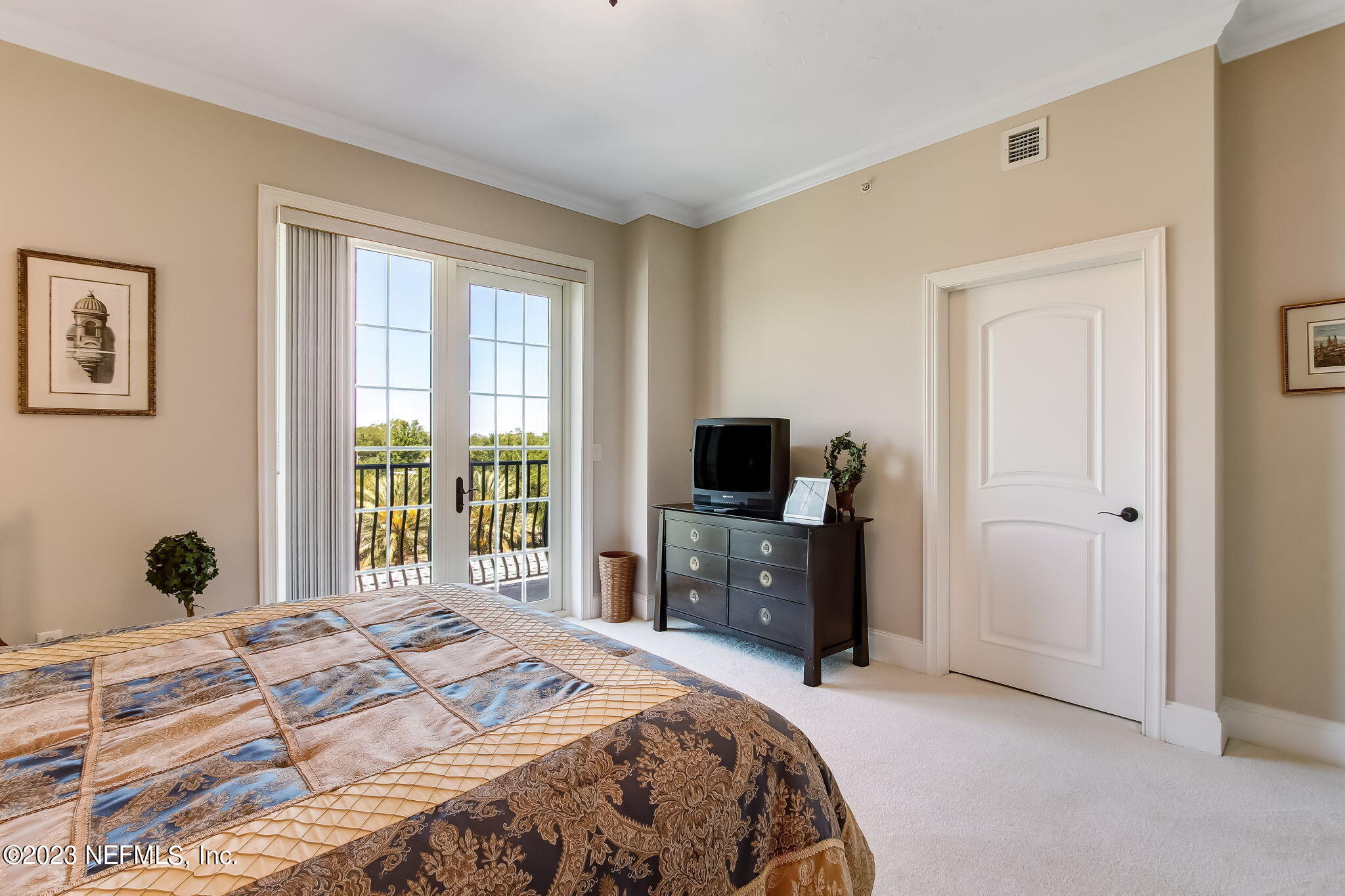 2358 Riverside Avenue, Unit 406 Jacksonville, FL 32204 - Photo 30 of 54 a bedroom with a bed and a television