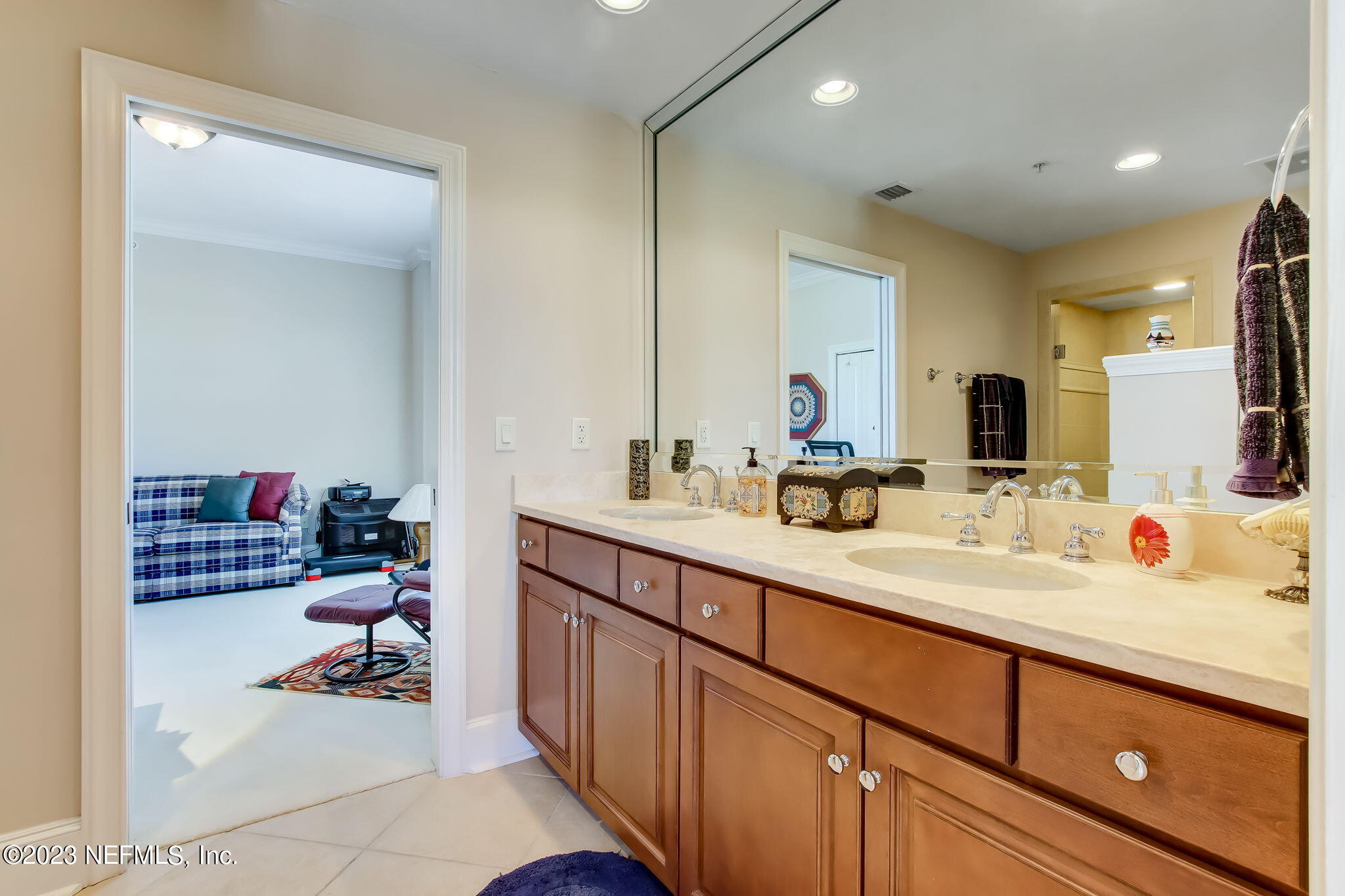 2358 Riverside Avenue, Unit 406 Jacksonville, FL 32204 - Photo 31 of 54 a bathroom with a sink double vanity and a mirror