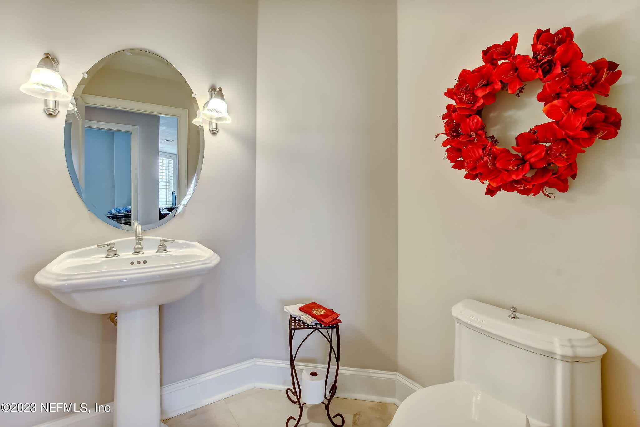 2358 Riverside Avenue, Unit 406 Jacksonville, FL 32204 - Photo 32 of 54 a bathroom with a sink mirror and toilet