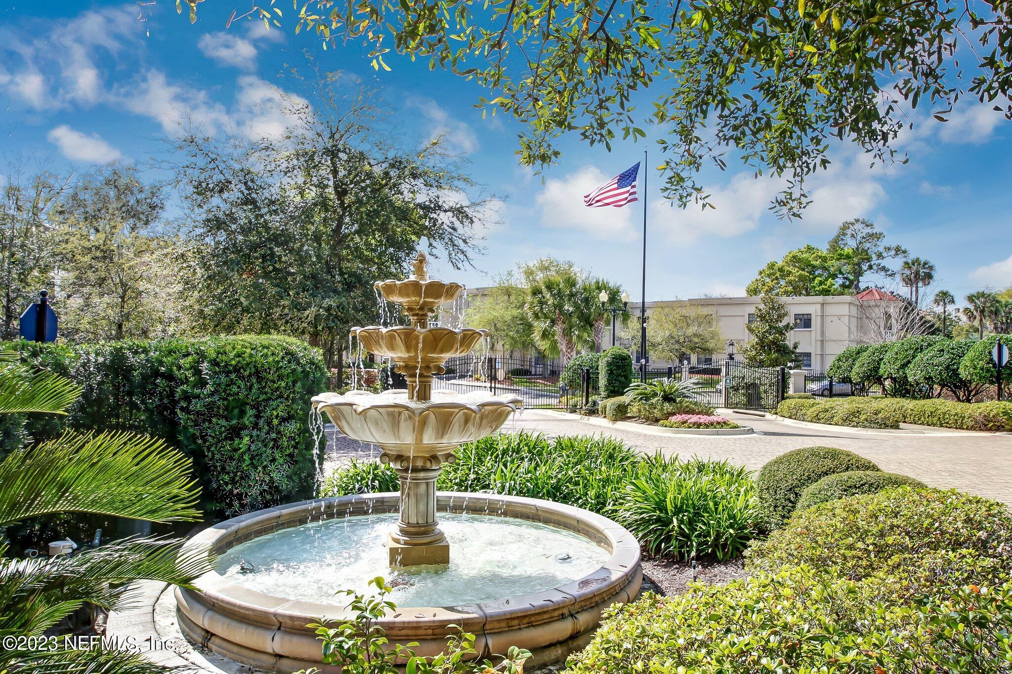 2358 Riverside Avenue, Unit 406 Jacksonville, FL 32204 - Photo 34 of 54 a view of a house with backyard fountain and sitting area