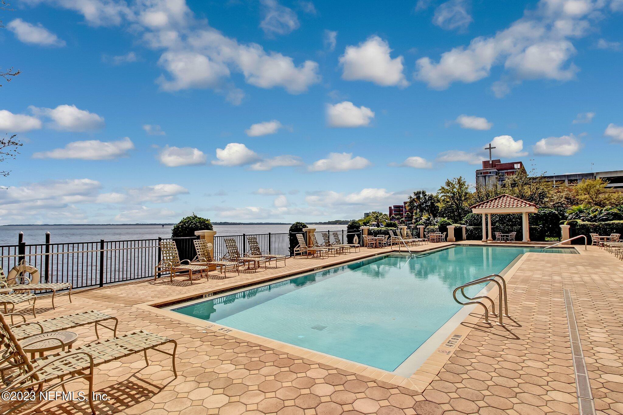 2358 Riverside Avenue, Unit 406 Jacksonville, FL 32204 - Photo 49 of 54 a view of a swimming pool with a patio