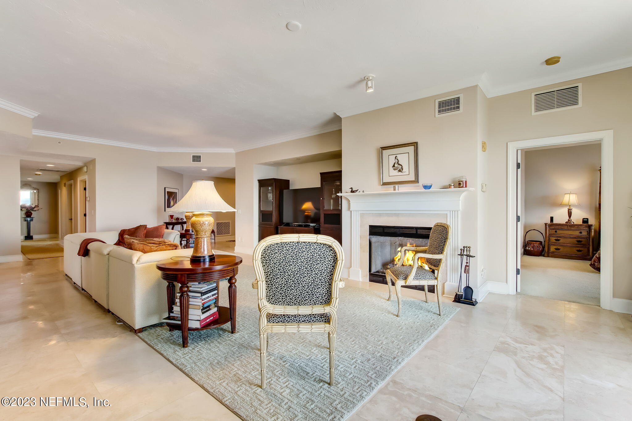 2358 Riverside Avenue, Unit 406 Jacksonville, FL 32204 - Photo 5 of 54 a living room with furniture and a fireplace