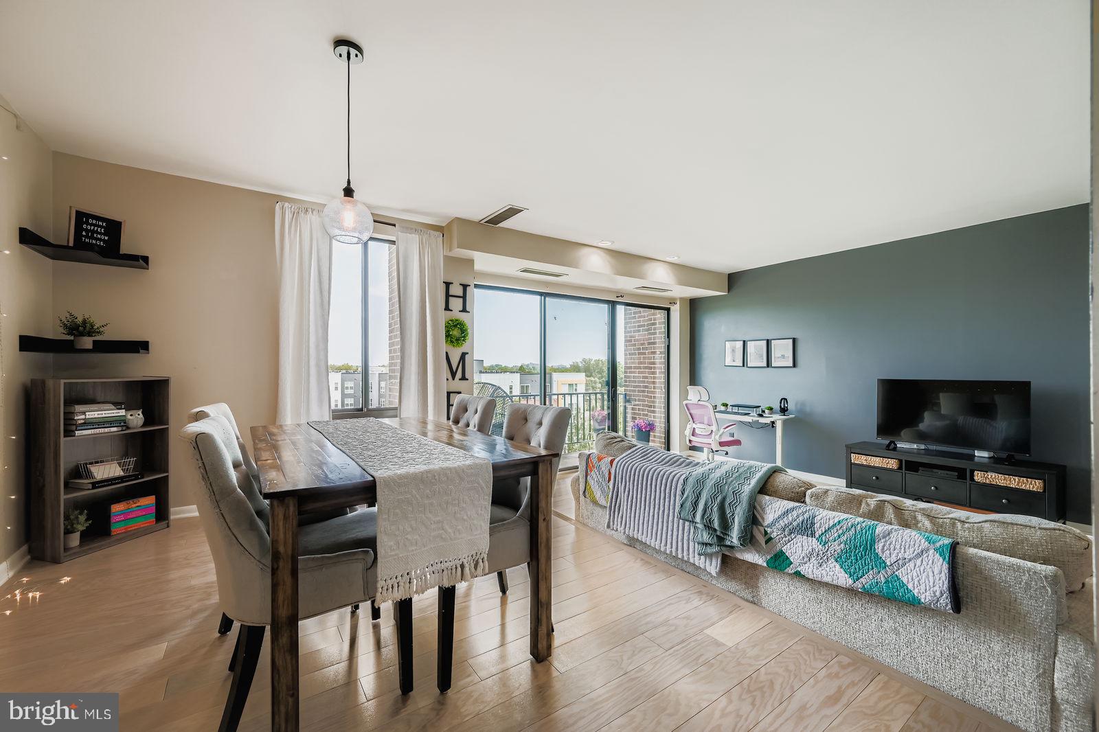 9900 Georgia Avenue, Unit 27716 Silver Spring, MD 20902 - Photo 11 of 37 a view of a livingroom with furniture and a flat screen tv