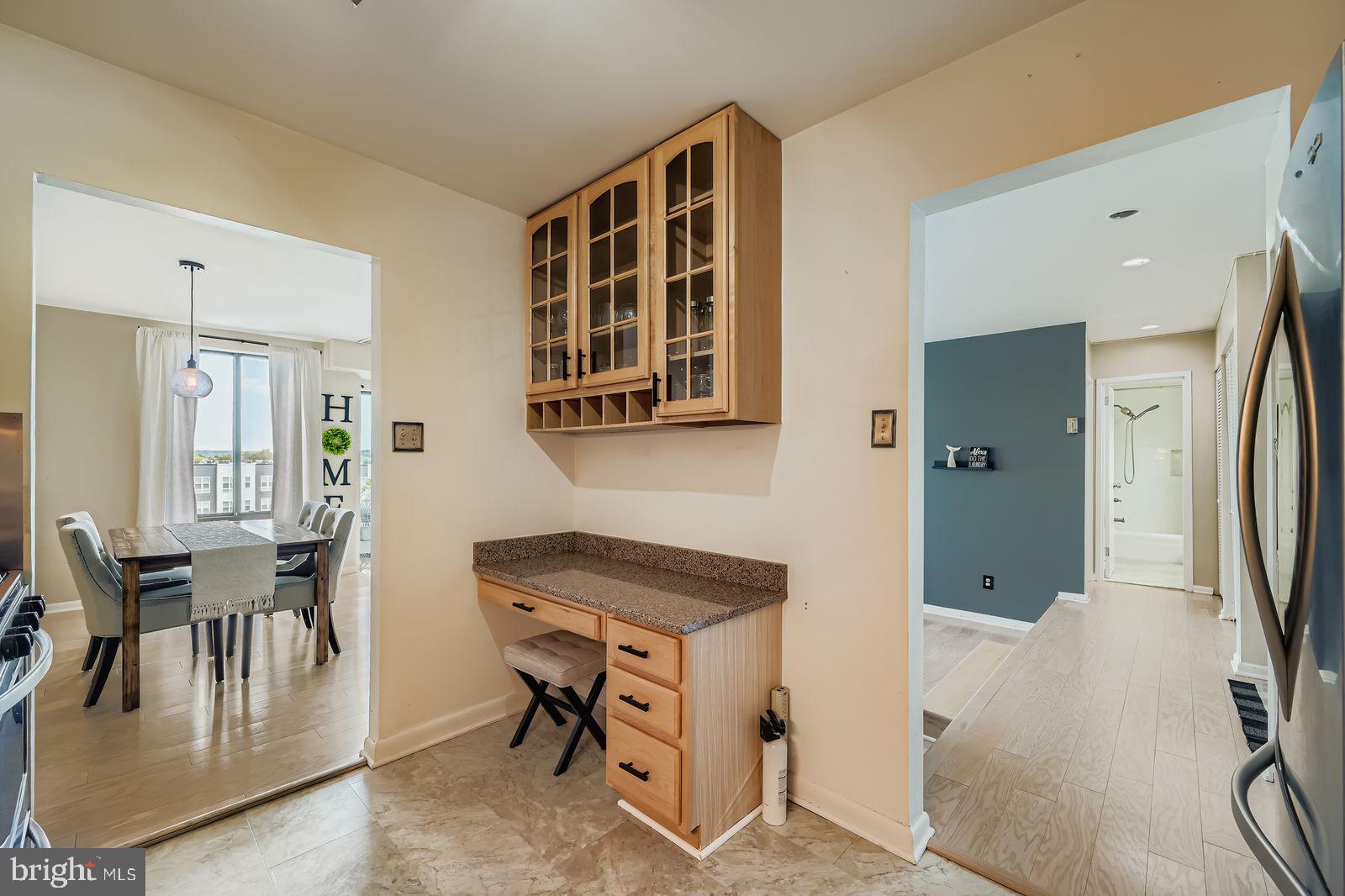 9900 Georgia Avenue, Unit 27716 Silver Spring, MD 20902 - Photo 14 of 37 a view of a livingroom with furniture and a window