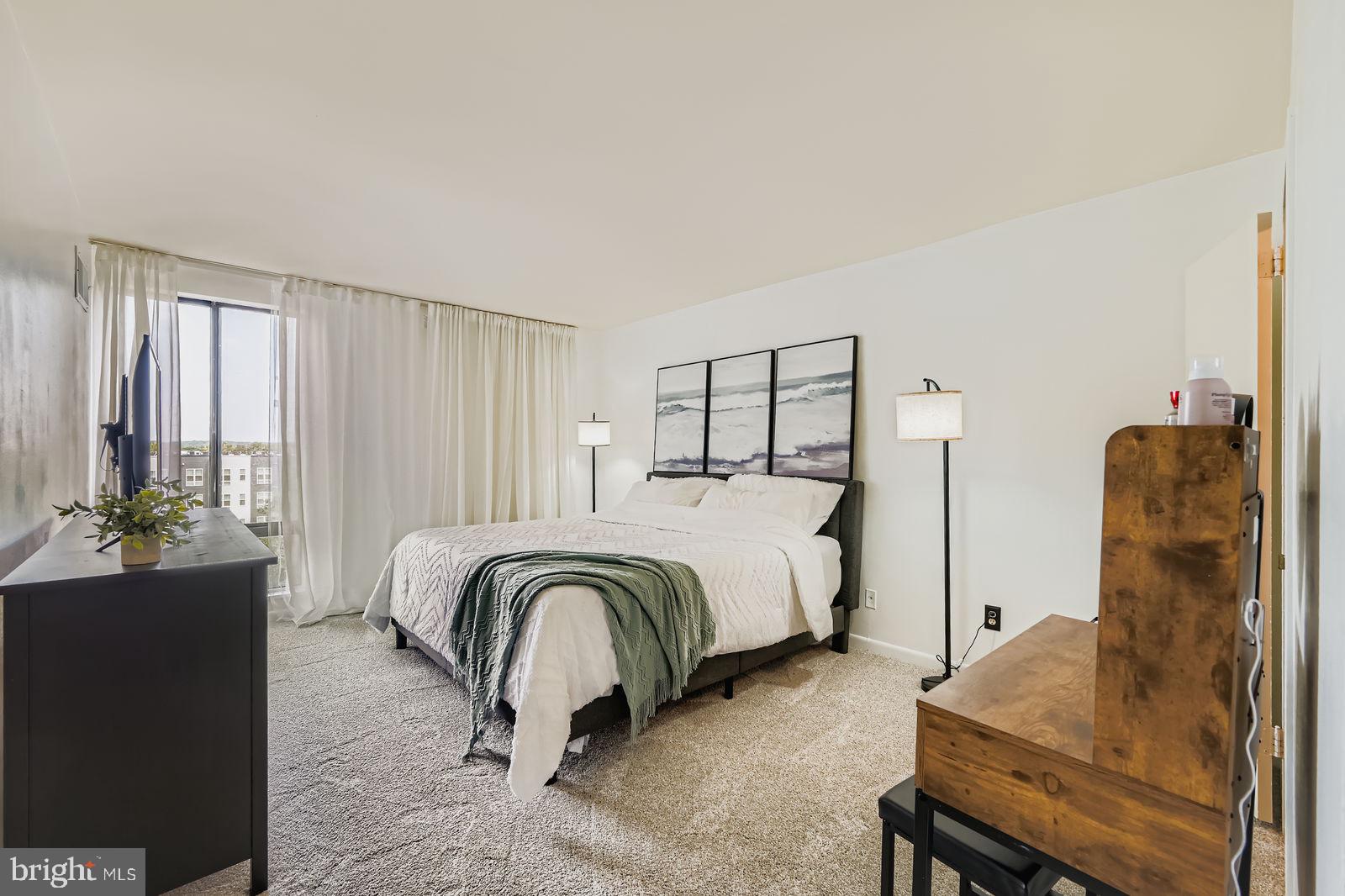 9900 Georgia Avenue, Unit 27716 Silver Spring, MD 20902 - Photo 18 of 37 a bedroom with a bed and window
