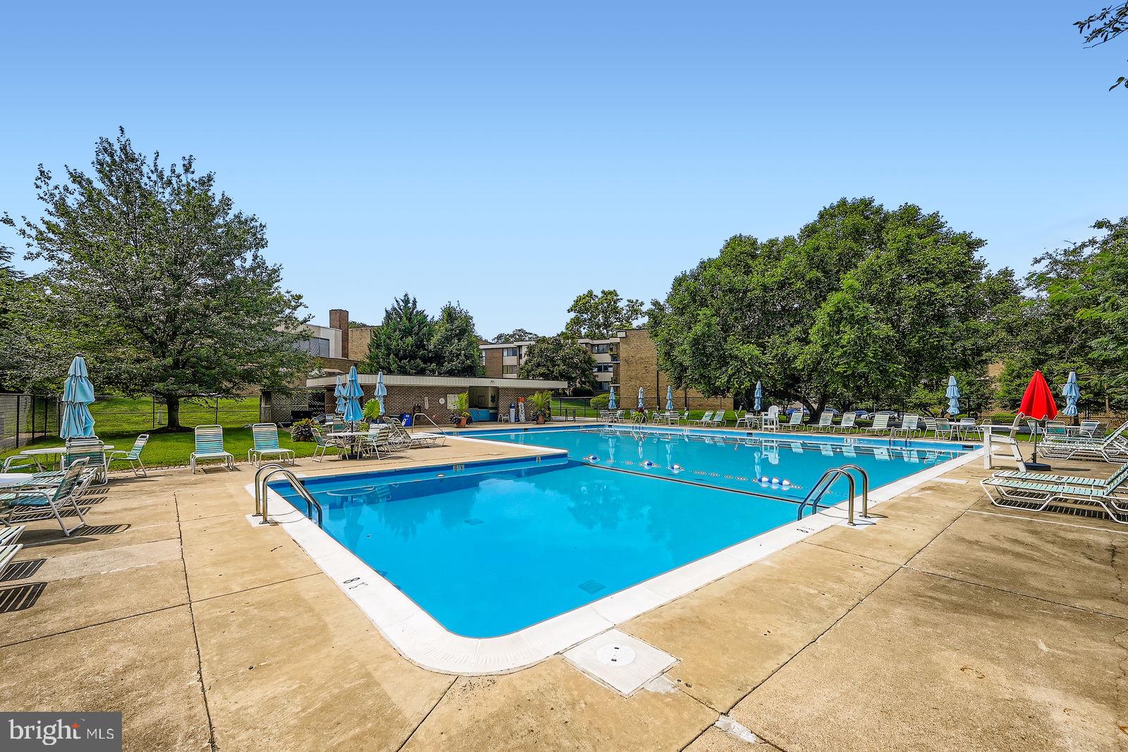 9900 Georgia Avenue, Unit 27716 Silver Spring, MD 20902 - Photo 29 of 37 a view of a swimming pool with lounge chair