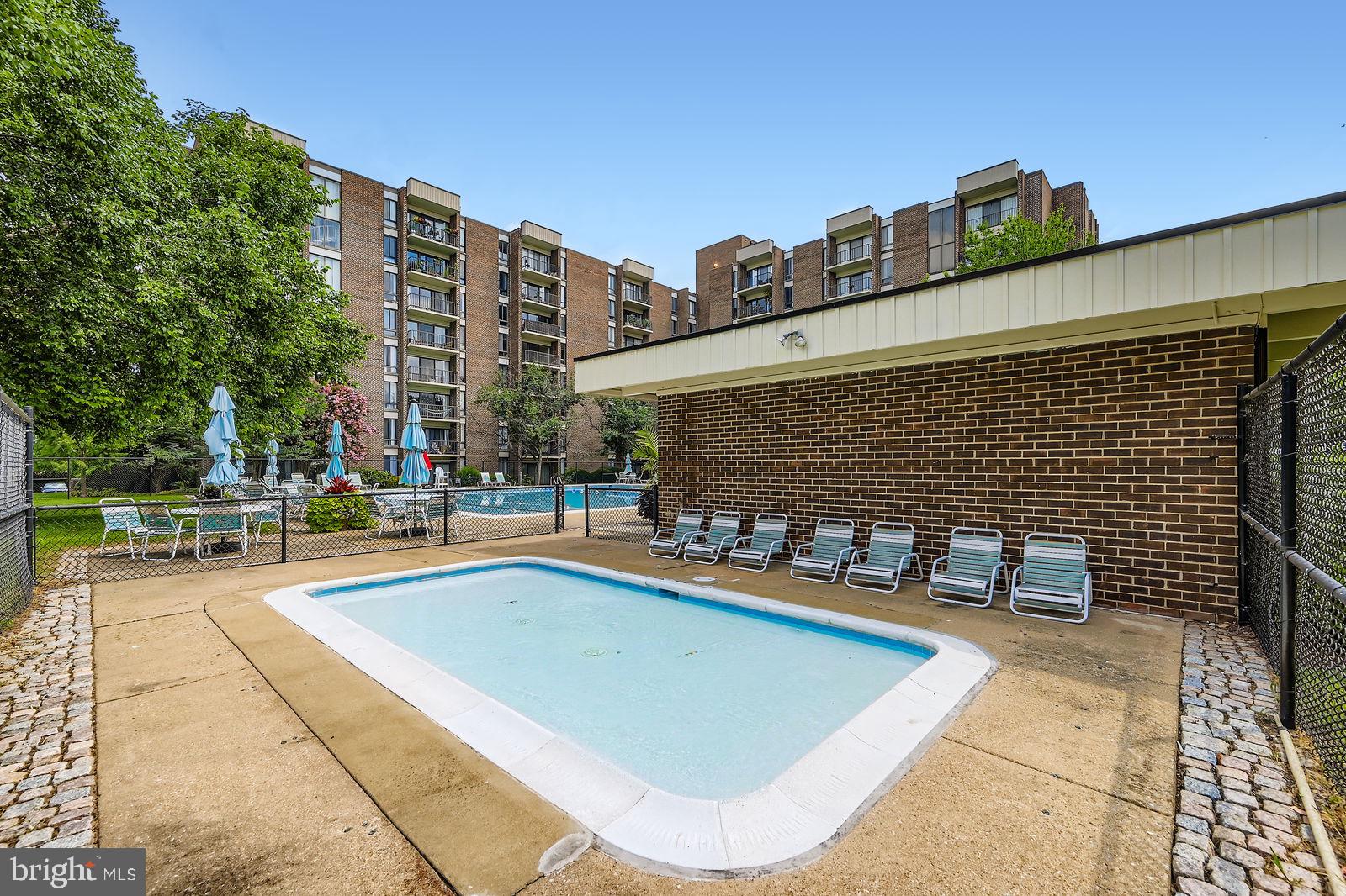 9900 Georgia Avenue, Unit 27716 Silver Spring, MD 20902 - Photo 30 of 37 a view of a patio with chairs and a table and chairs