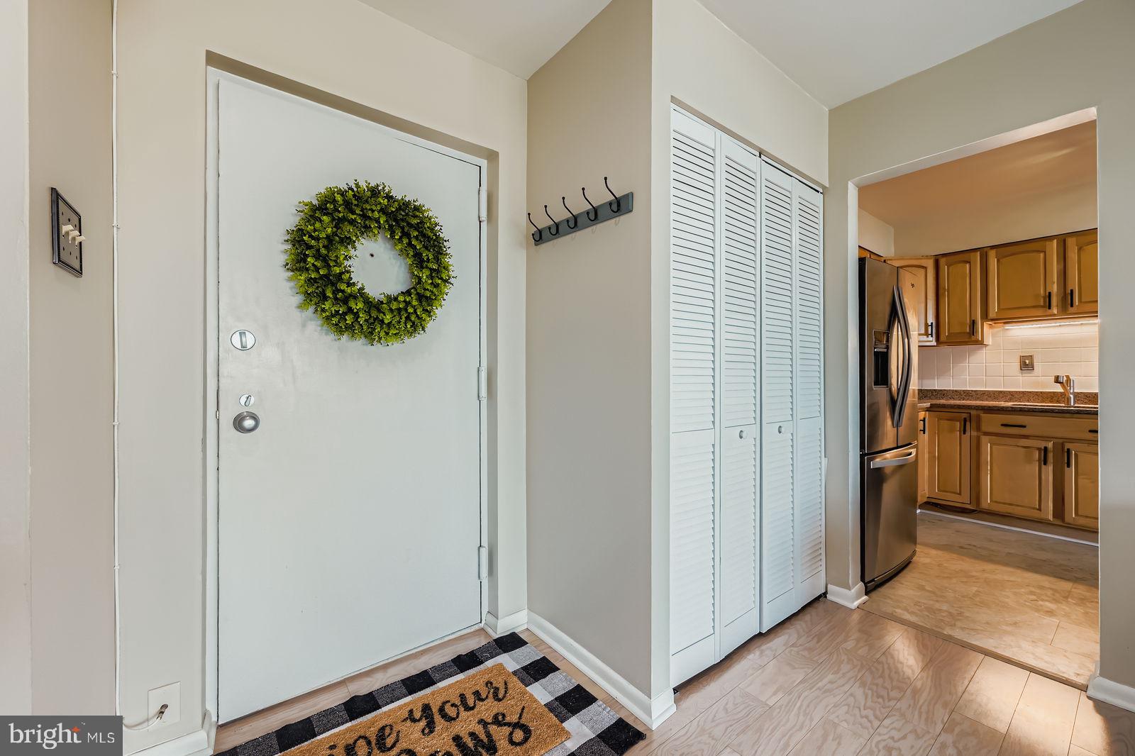 9900 Georgia Avenue, Unit 27716 Silver Spring, MD 20902 - Photo 3 of 37 a view of a hallway with washer and dryer