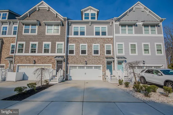 a front view of a house with a garage
