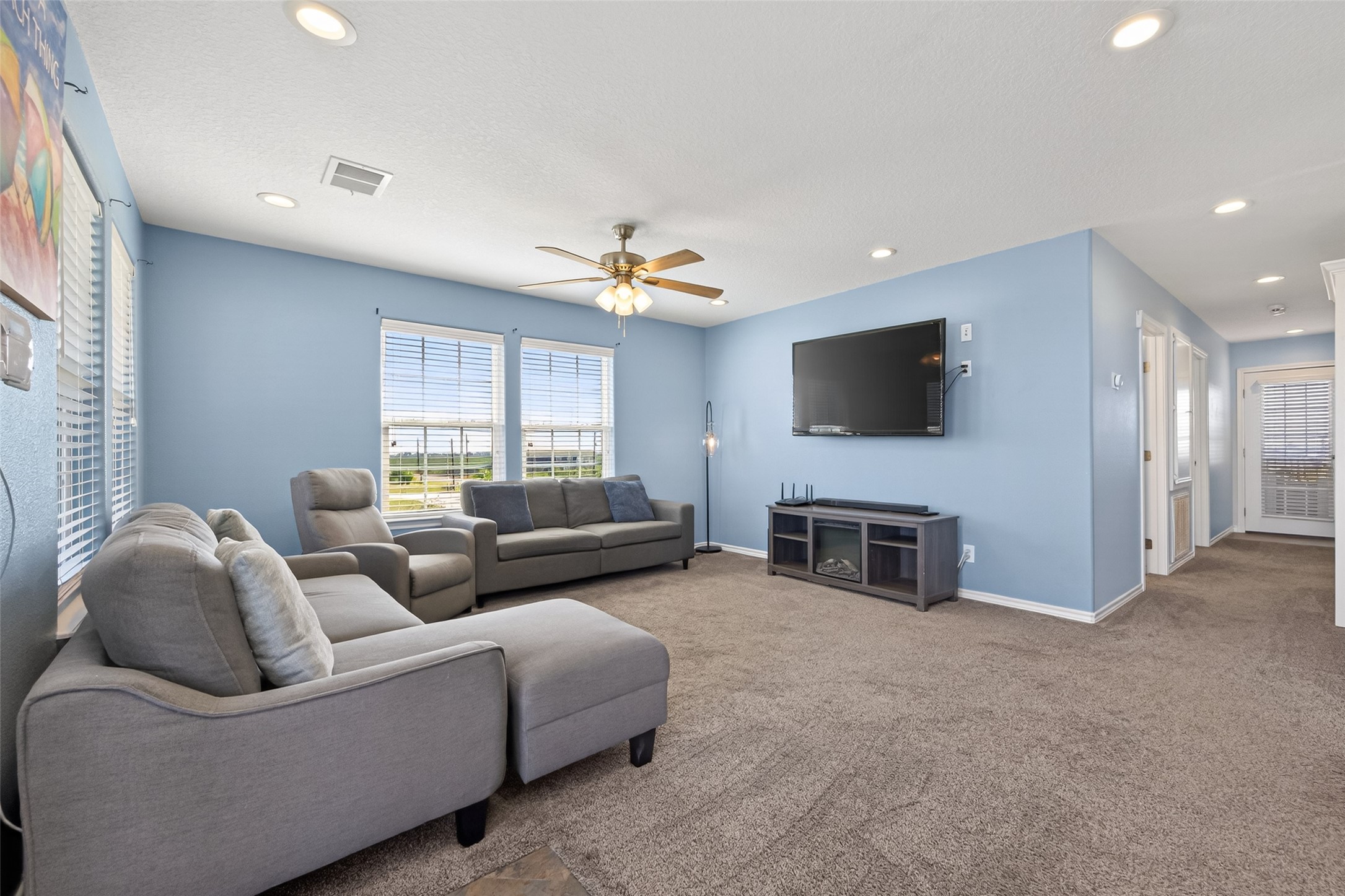 1127 County Road 299 Sargent, TX 77414 - Photo 11 of 46 a living room with furniture and a flat screen tv