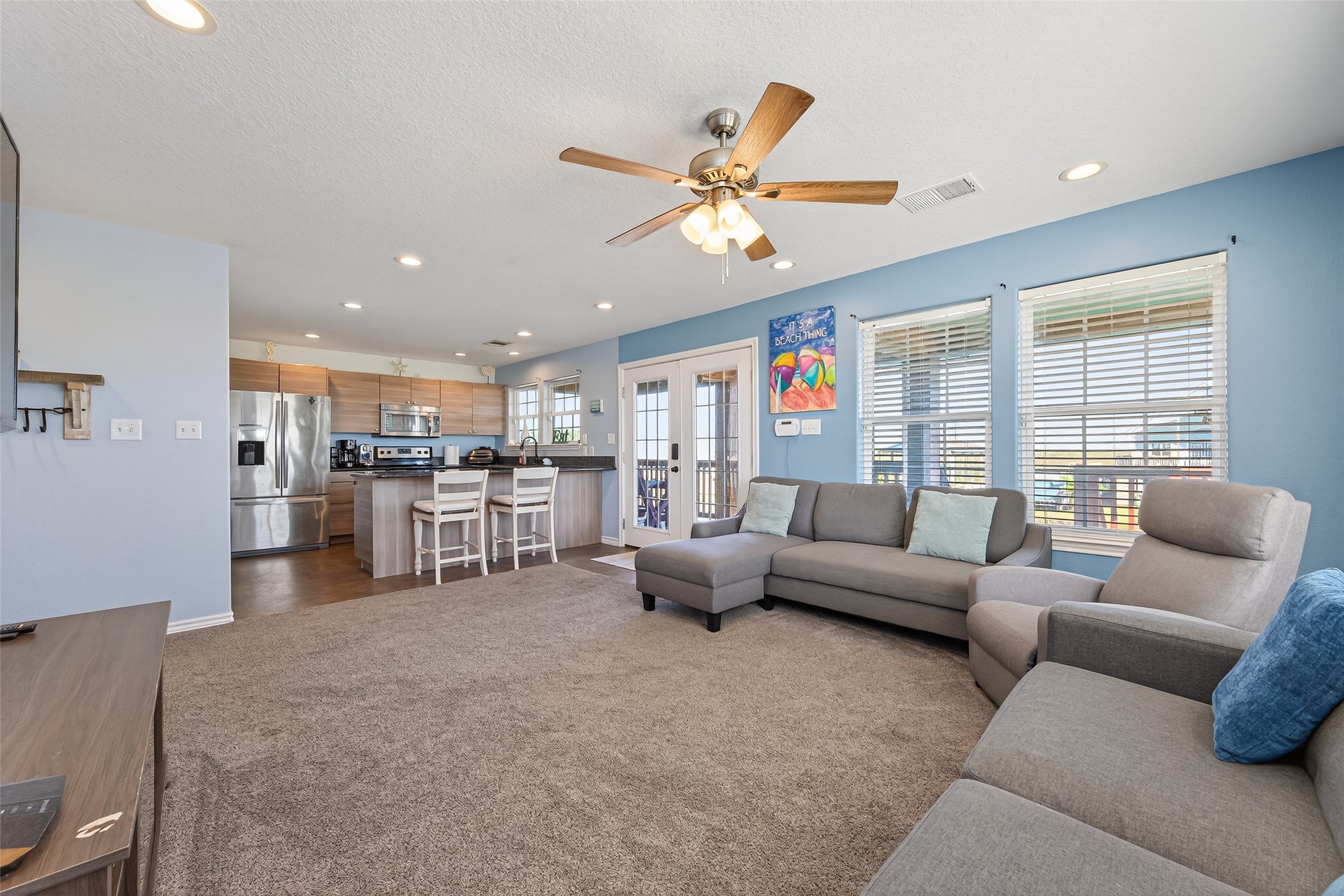 1127 County Road 299 Sargent, TX 77414 - Photo 12 of 46 a living room with furniture and kitchen view