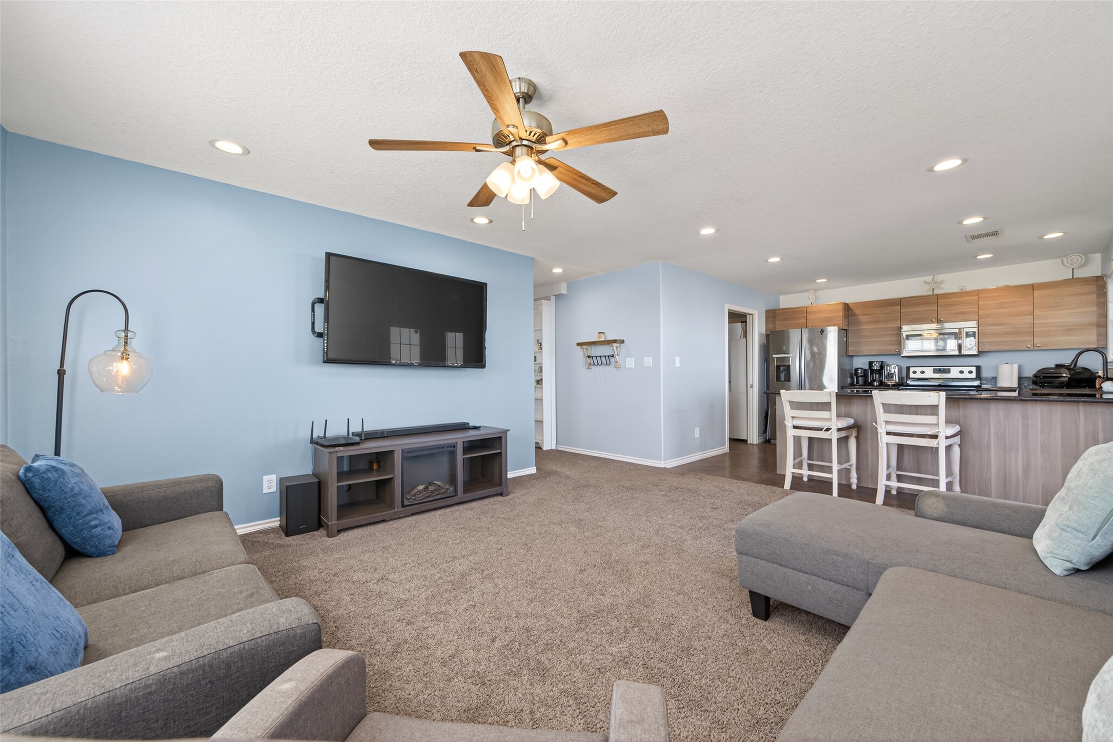 1127 County Road 299 Sargent, TX 77414 - Photo 45 of 46 a living room with furniture and a flat screen tv