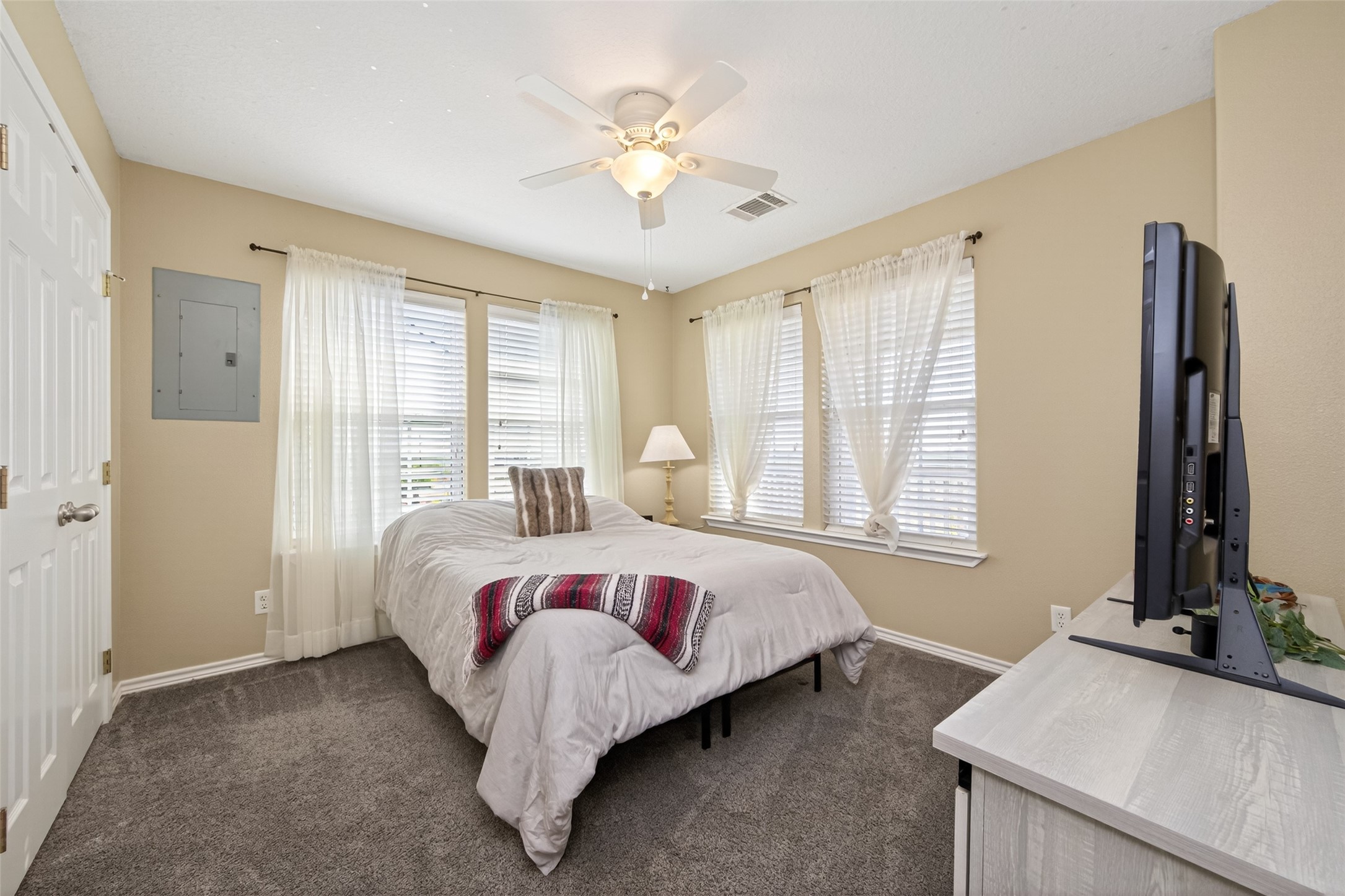 1127 County Road 299 Sargent, TX 77414 - Photo 21 of 46 a bed room with a bed and a window