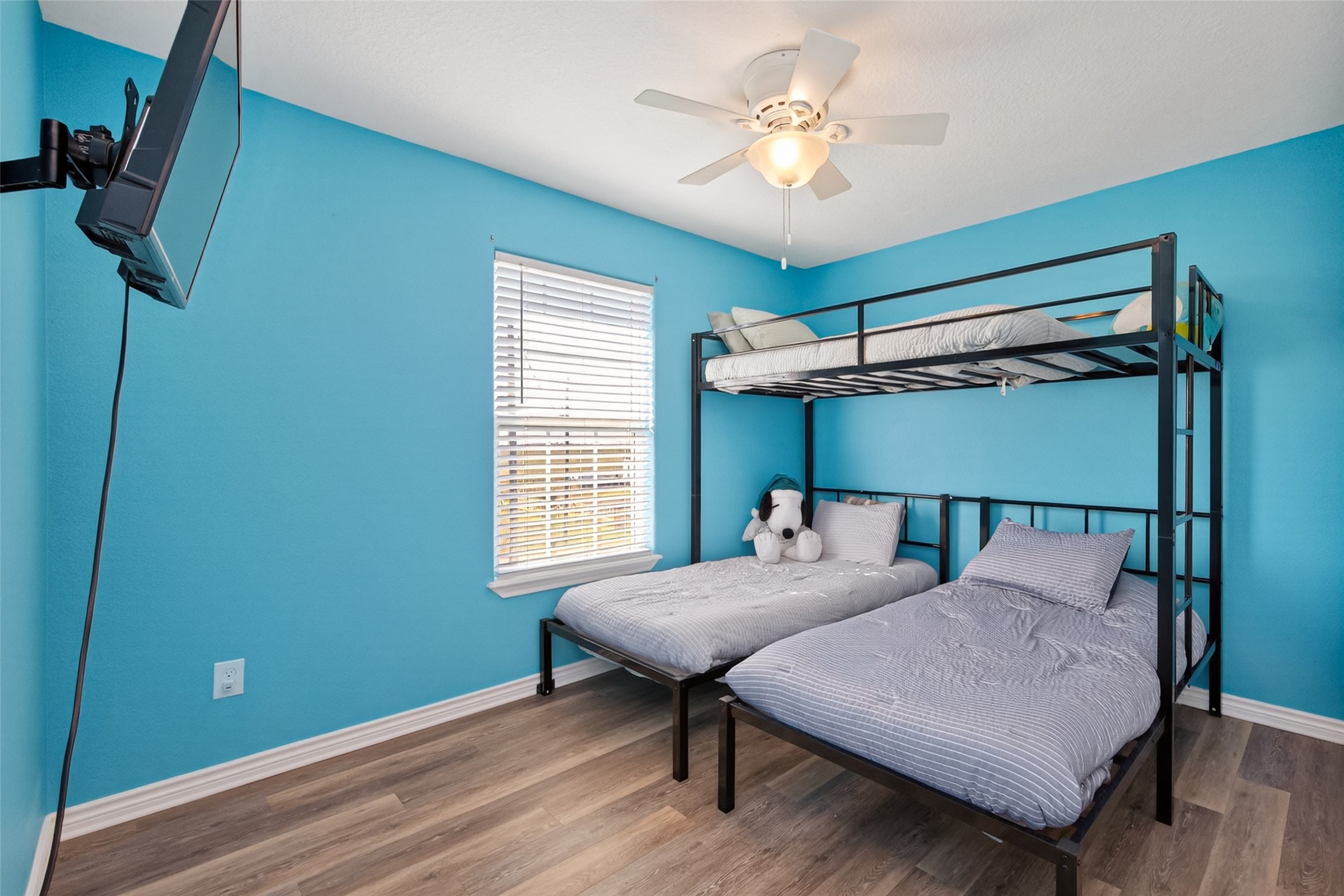 1127 County Road 299 Sargent, TX 77414 - Photo 28 of 46 a bedroom with a bed and a chandelier