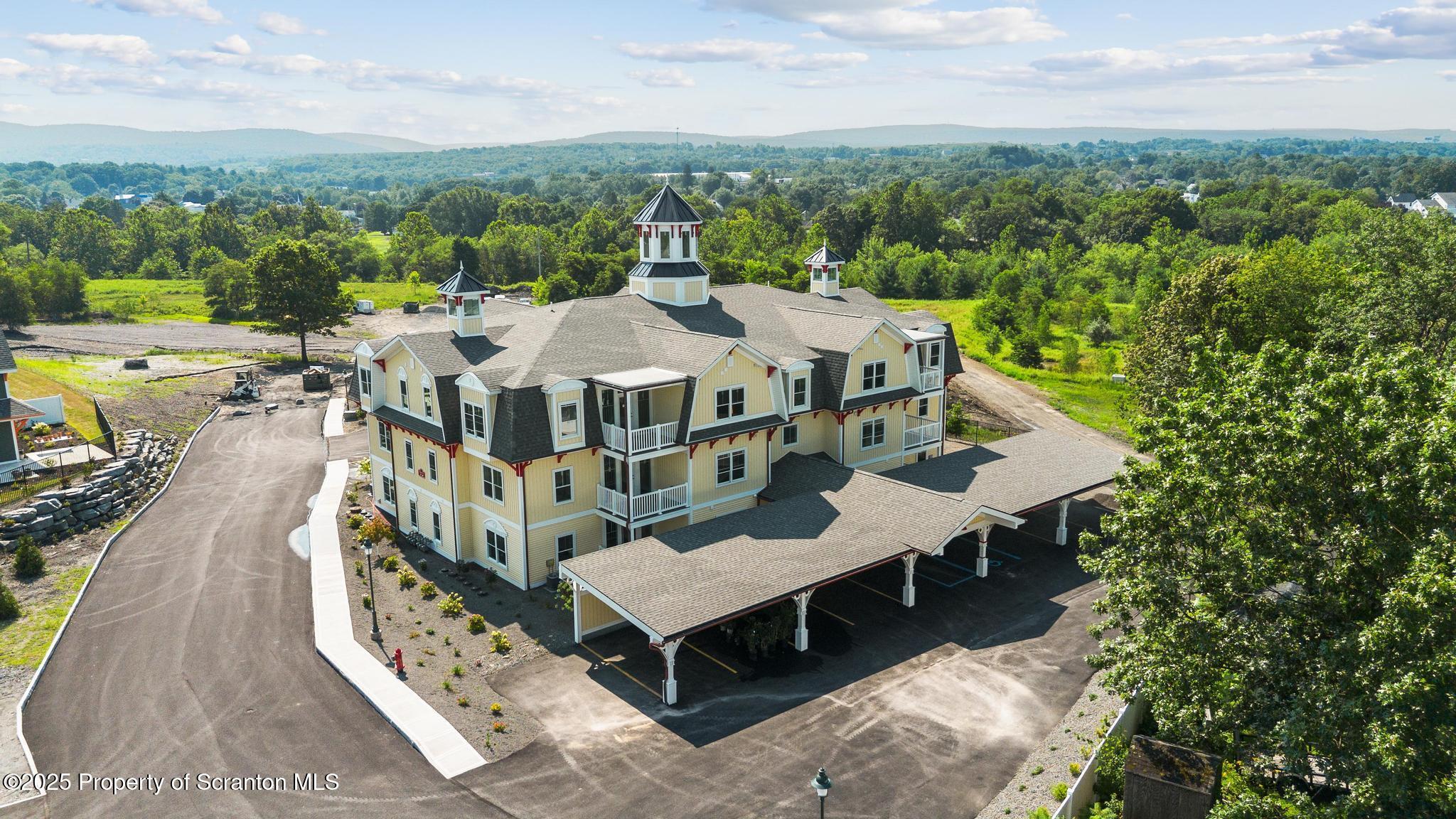 47 Zackery Way Old Forge, PA 18518 - Photo 2 of 26 an aerial view of a house with a big yard