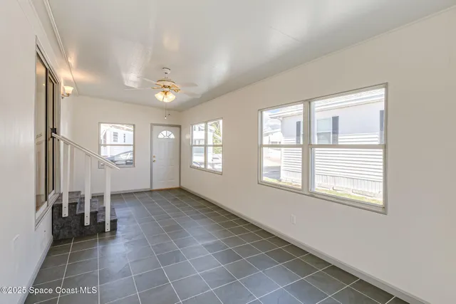 a view of an empty room with a window