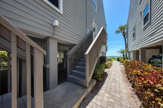 a view of a house with stairs and wooden floor
