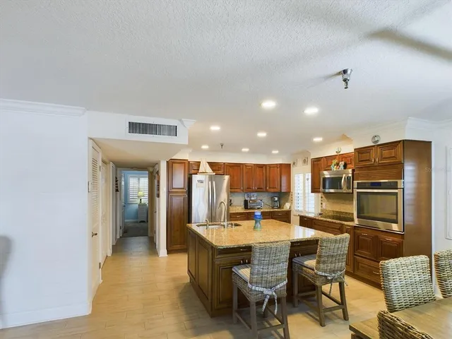 a kitchen with a refrigerator and cabinets