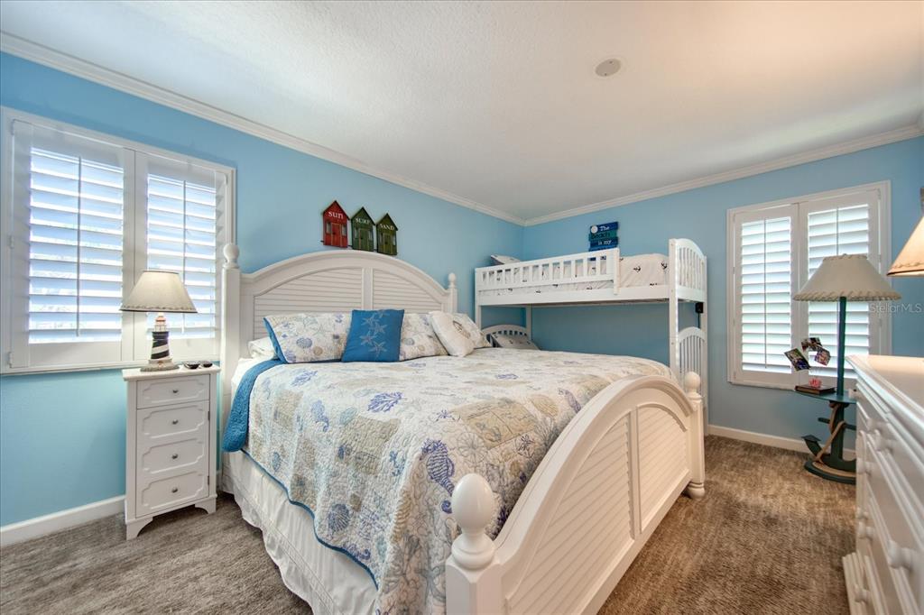 19930 Gulf Boulevard, Unit 5C Indian Shores, FL 33785 - Photo 31 of 55 a bedroom with a bed and a closet