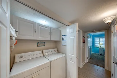 a bedroom with a bed and a lamp