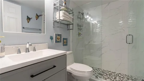 a view of multiple houses with a yard