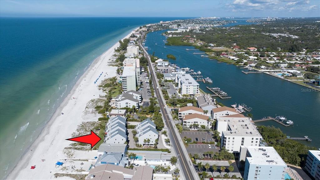 19930 Gulf Boulevard, Unit 5C Indian Shores, FL 33785 - Photo 8 of 55 an aerial view of residential houses with outdoor space