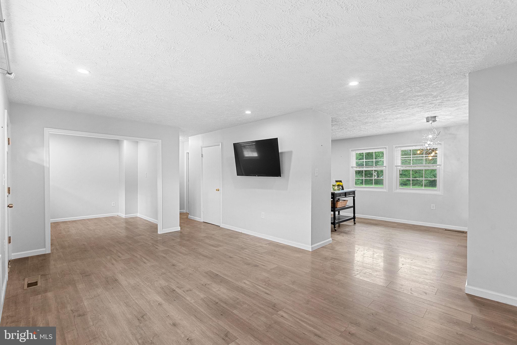 21506 Shellhorn Road Ashburn, VA 20147 - Photo 11 of 42 a view of a livingroom with wooden floor and windows