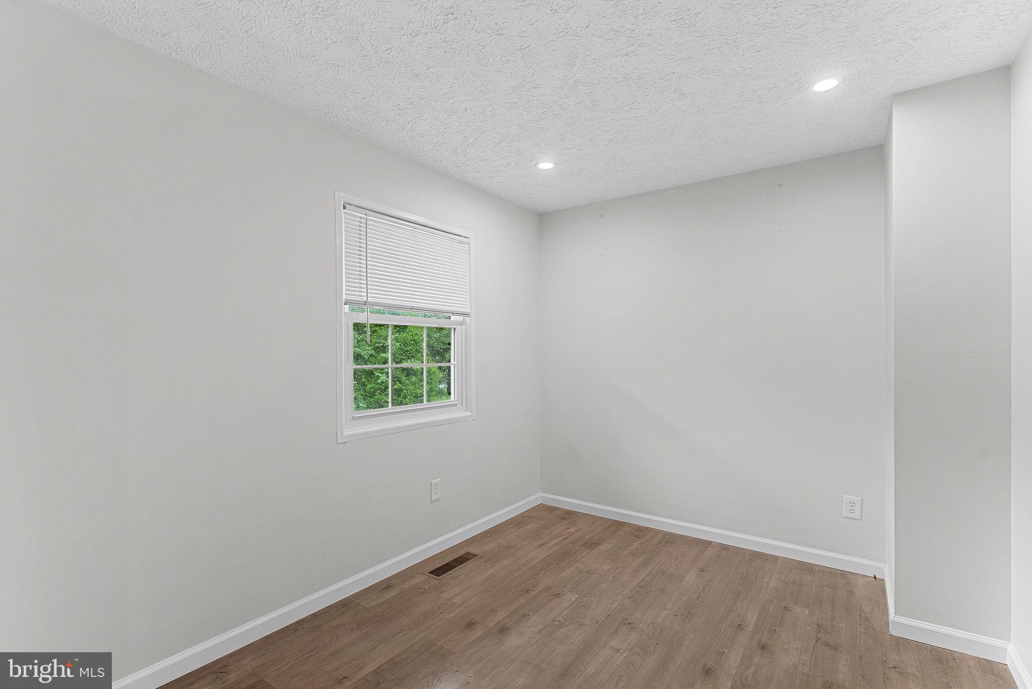 21506 Shellhorn Road Ashburn, VA 20147 - Photo 13 of 42 an empty room with a window