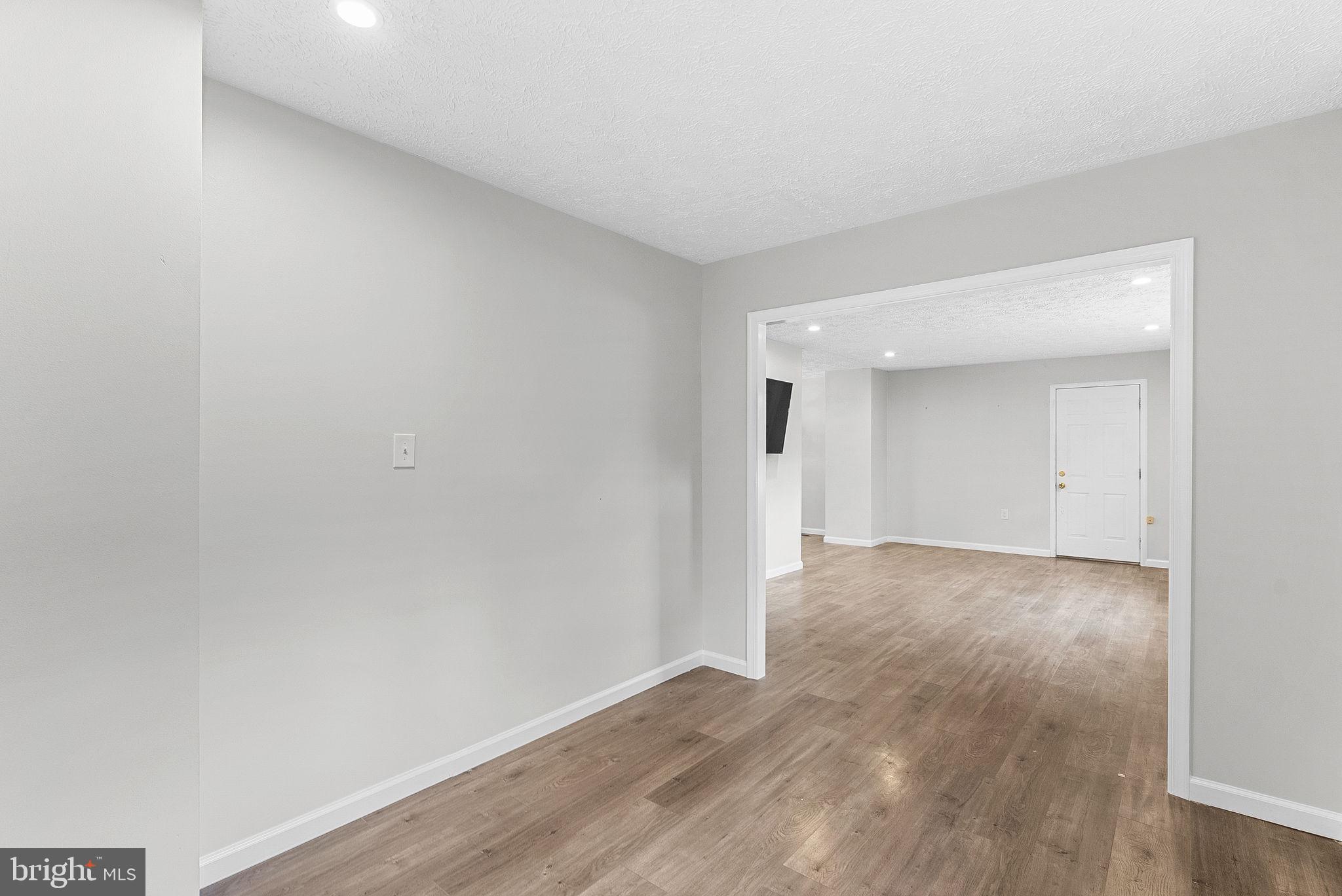 21506 Shellhorn Road Ashburn, VA 20147 - Photo 14 of 42 a view of an empty room and wooden floor