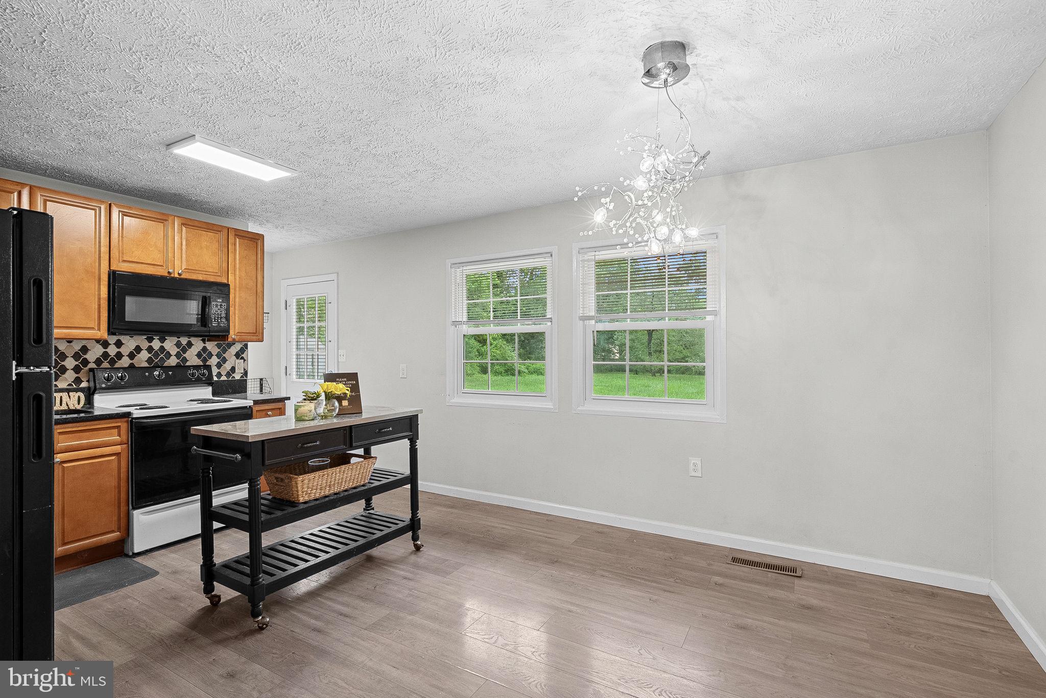 21506 Shellhorn Road Ashburn, VA 20147 - Photo 16 of 42 a view of a workspace with furniture and a window