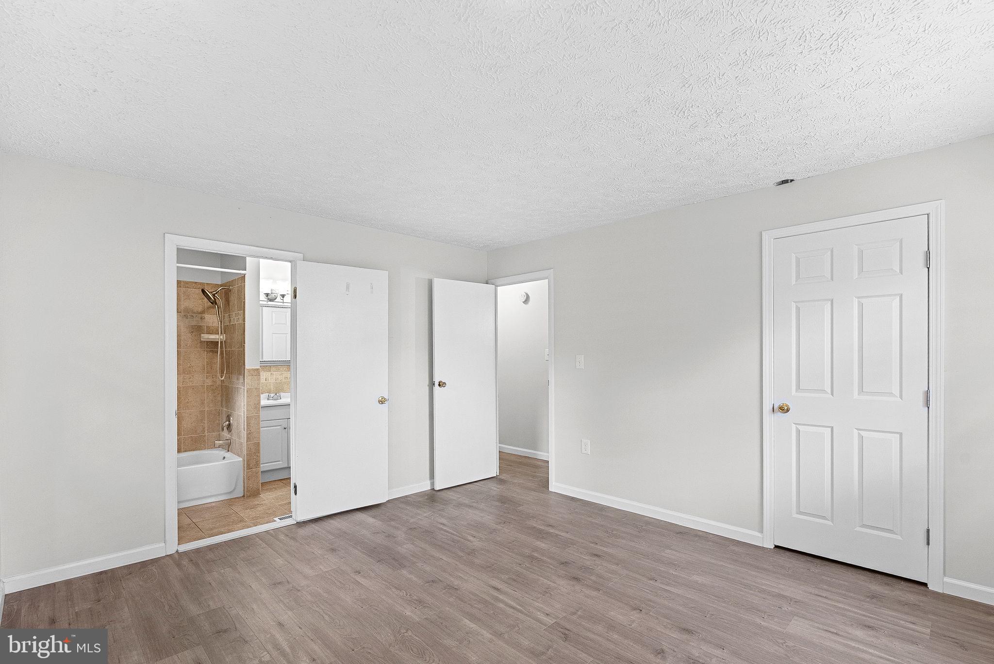 21506 Shellhorn Road Ashburn, VA 20147 - Photo 23 of 42 a view of an empty room with wooden floor