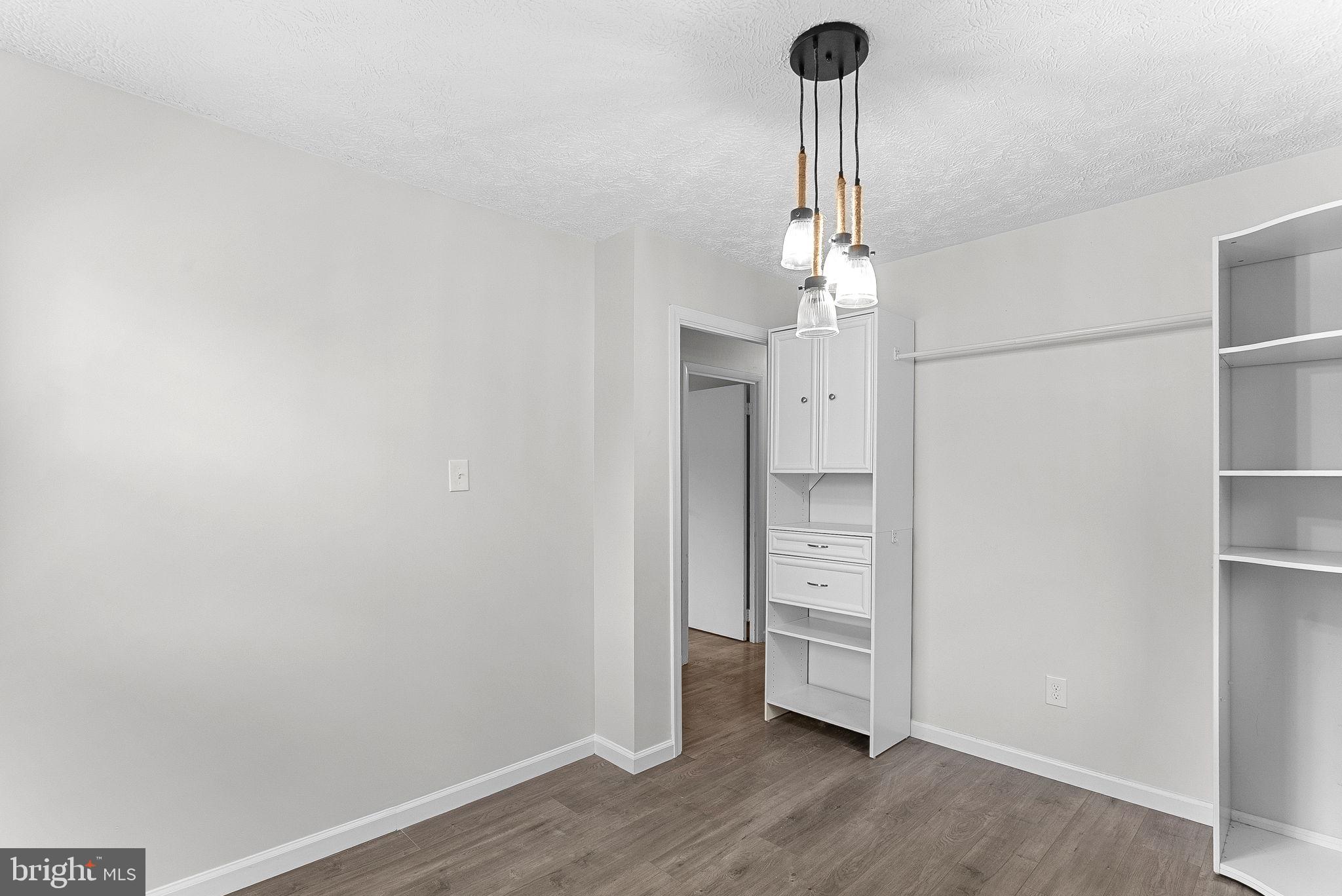 21506 Shellhorn Road Ashburn, VA 20147 - Photo 28 of 42 a view of empty room with wooden floor and window
