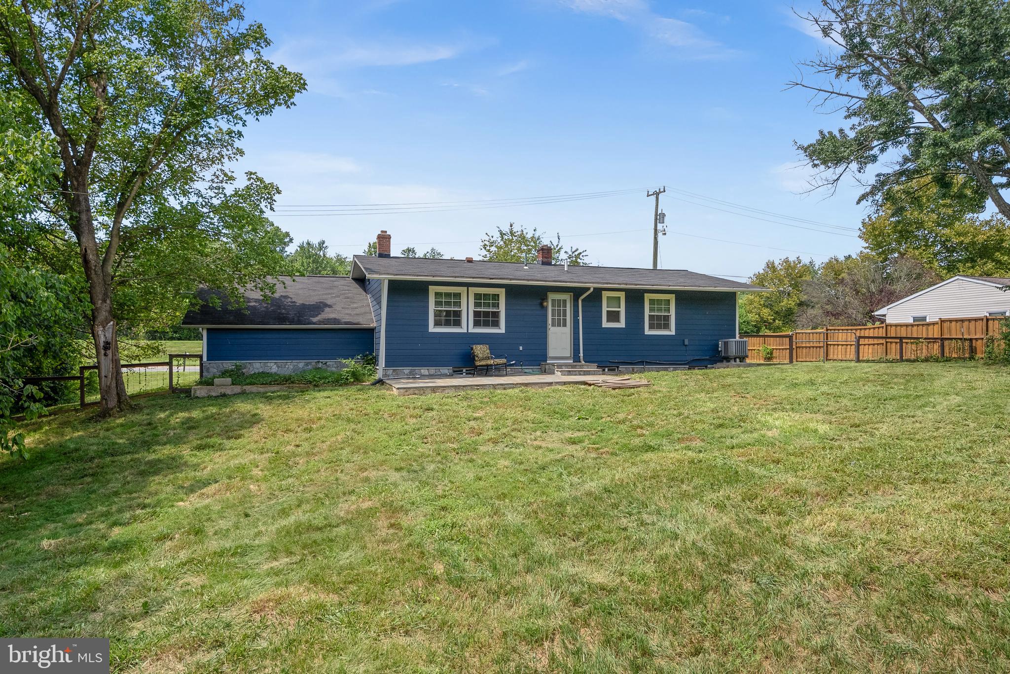 21506 Shellhorn Road Ashburn, VA 20147 - Photo 34 of 42 a front view of a house with a garden
