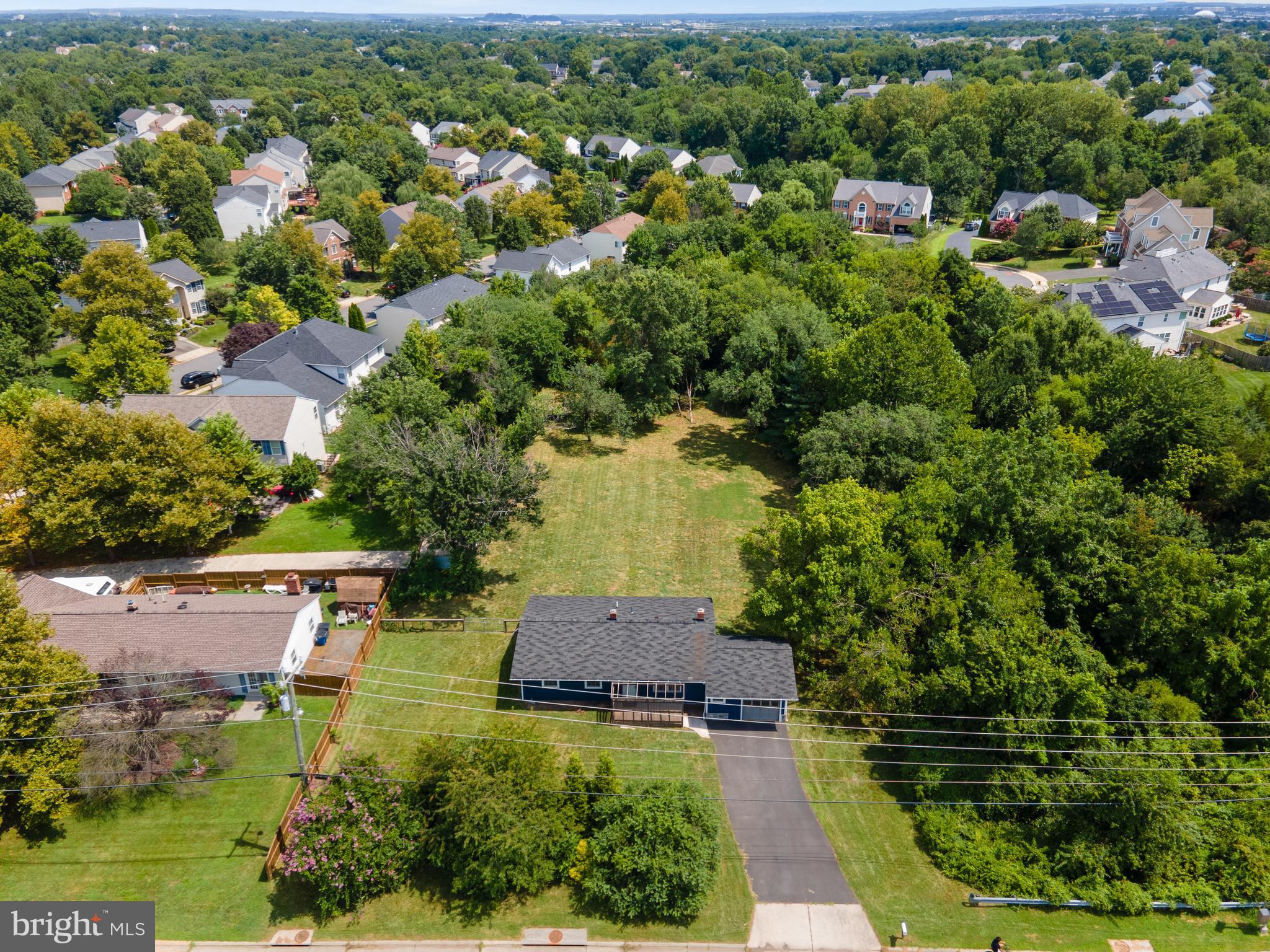 21506 Shellhorn Road Ashburn, VA 20147 - Photo 36 of 42 an aerial view of residential houses with outdoor space and trees