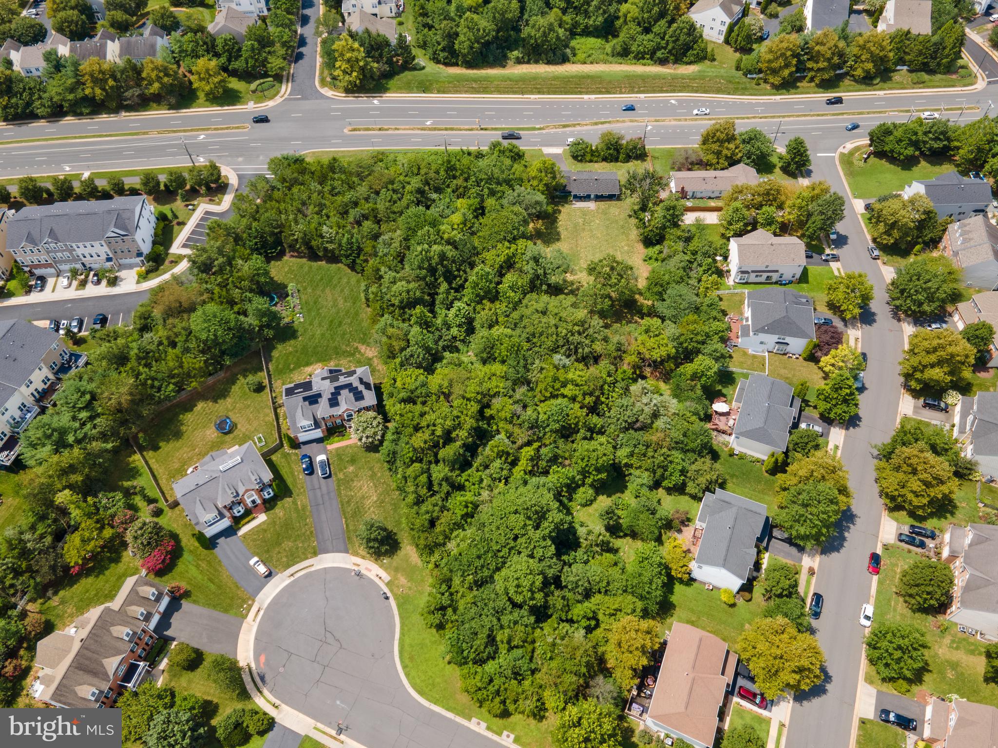21506 Shellhorn Road Ashburn, VA 20147 - Photo 40 of 42 an aerial view of a house with a yard and trees