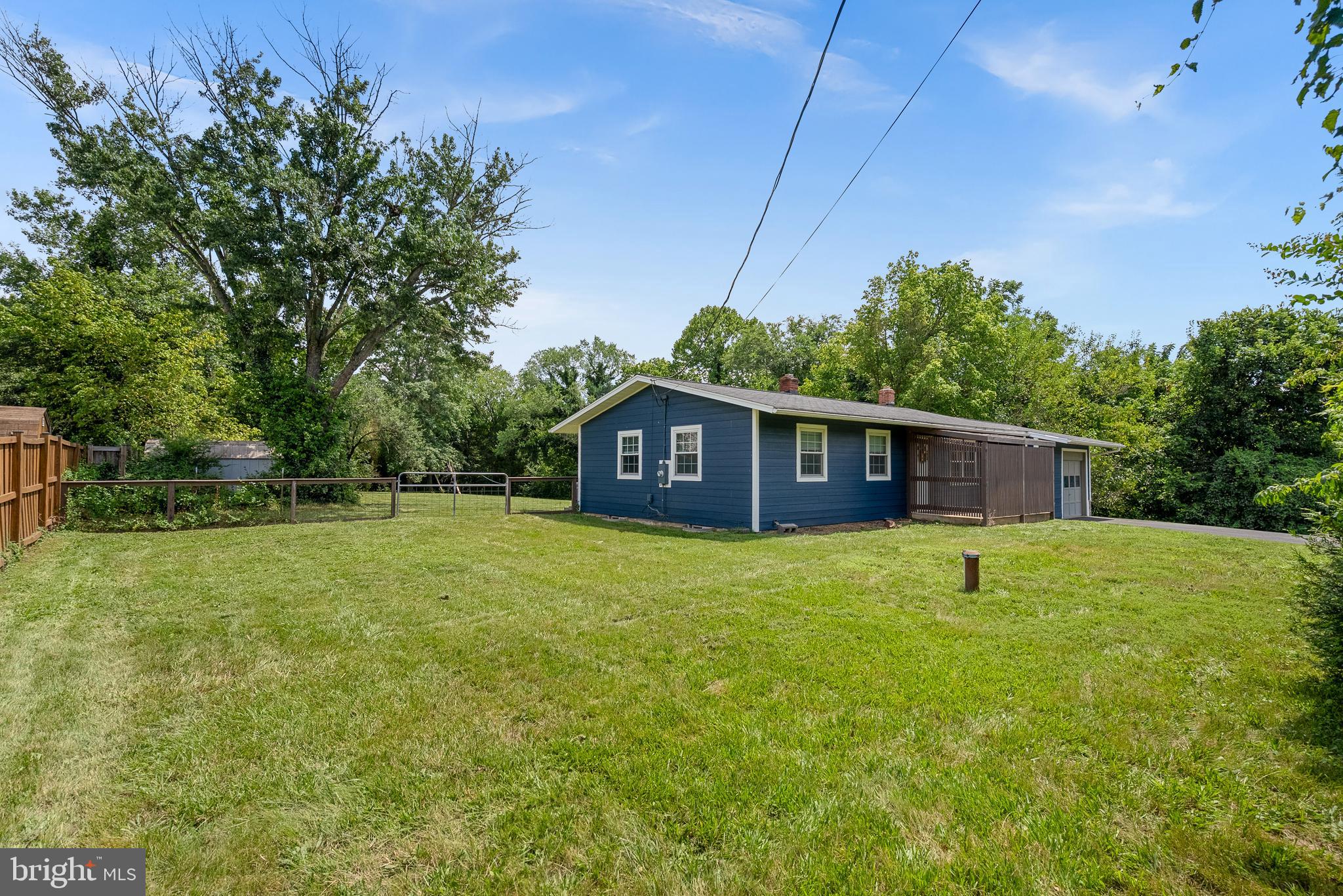 21506 Shellhorn Road Ashburn, VA 20147 - Photo 4 of 42 a house is sitting in middle of the green field