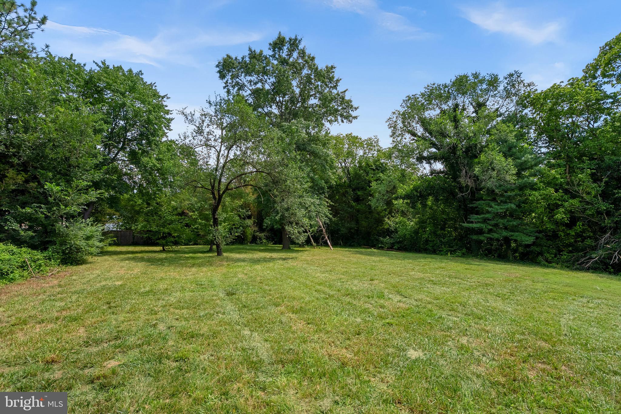 21506 Shellhorn Road Ashburn, VA 20147 - Photo 5 of 42 a view of a field with trees in the background