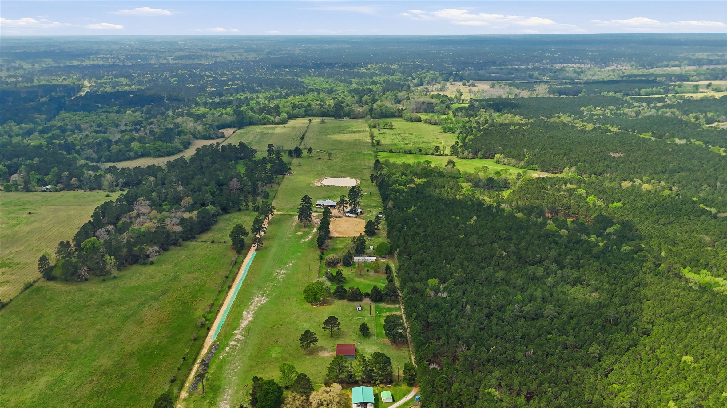 872 Four Notch Road Huntsville, TX 77340 - Photo 37 of 42 Expansive rural property offering vast open fields and lush green forests, ideal for privacy and outdoor activities.