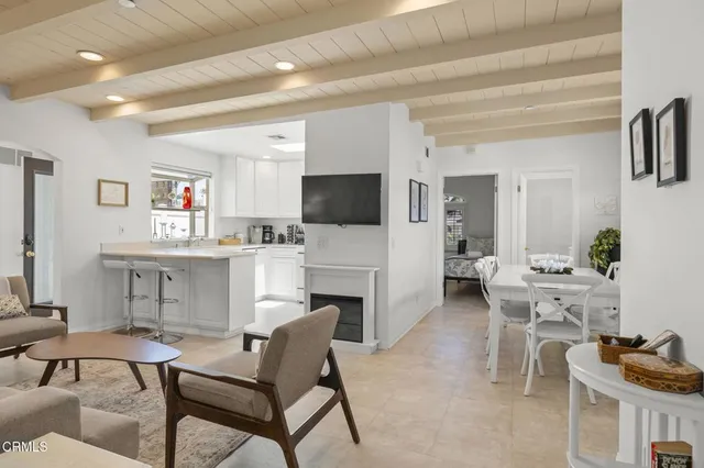 a living room with furniture and a lamp