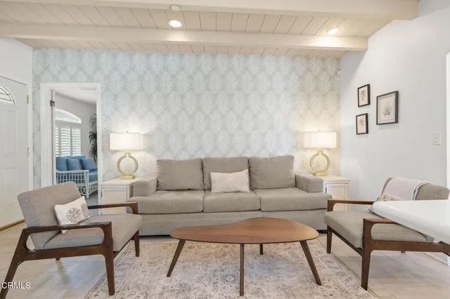 a kitchen with stainless steel appliances a stove a sink and a microwave