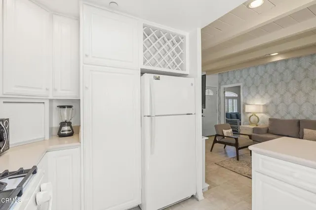 a bedroom with two beds and a large window
